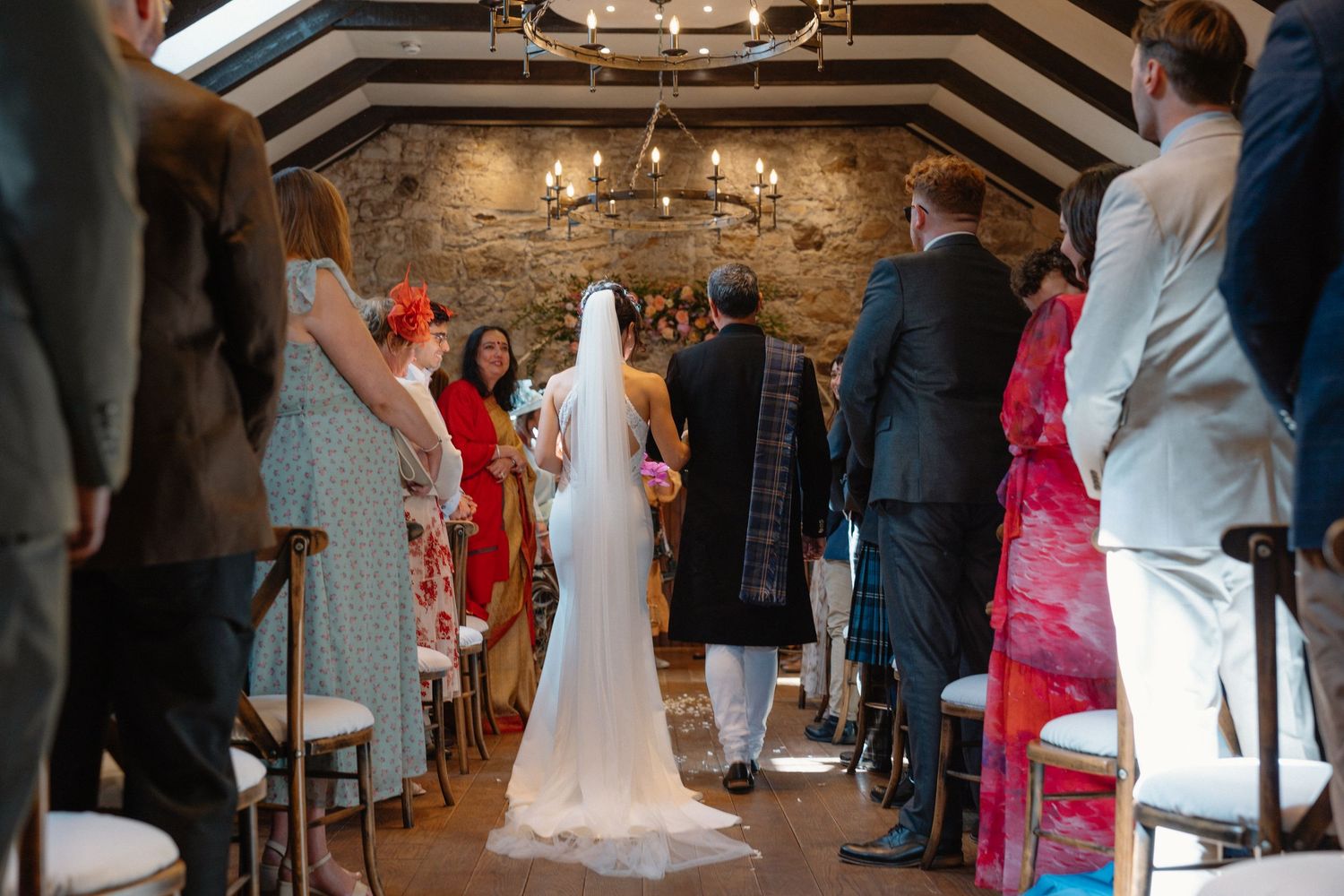 Wedding ceremony, bride walking down the isle with Dad, at Rosebery Steading, Temple, Gorebridge, Scotland.