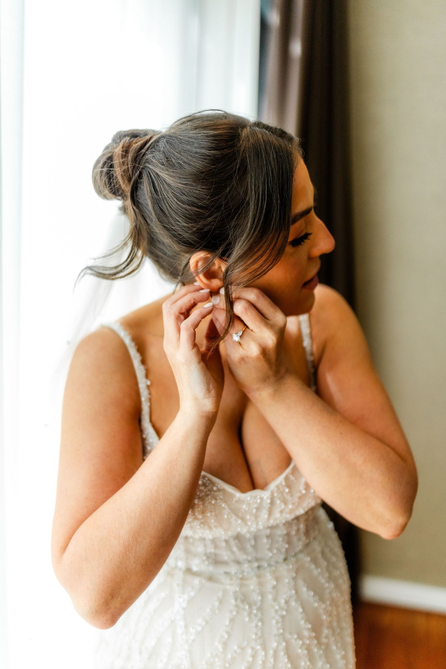 Bride putting earrings, getting ready, Glass House Edinburgh, Scotland,
