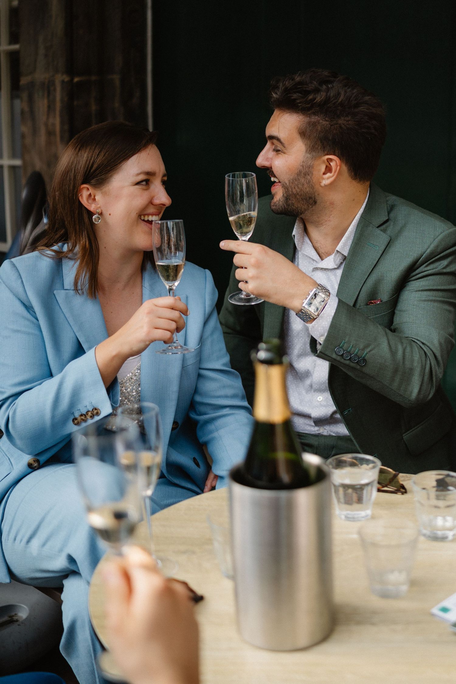 Wedding celebration bride and groom with a glass of fizz in Scotts Restaurant in Edinburgh Scotland