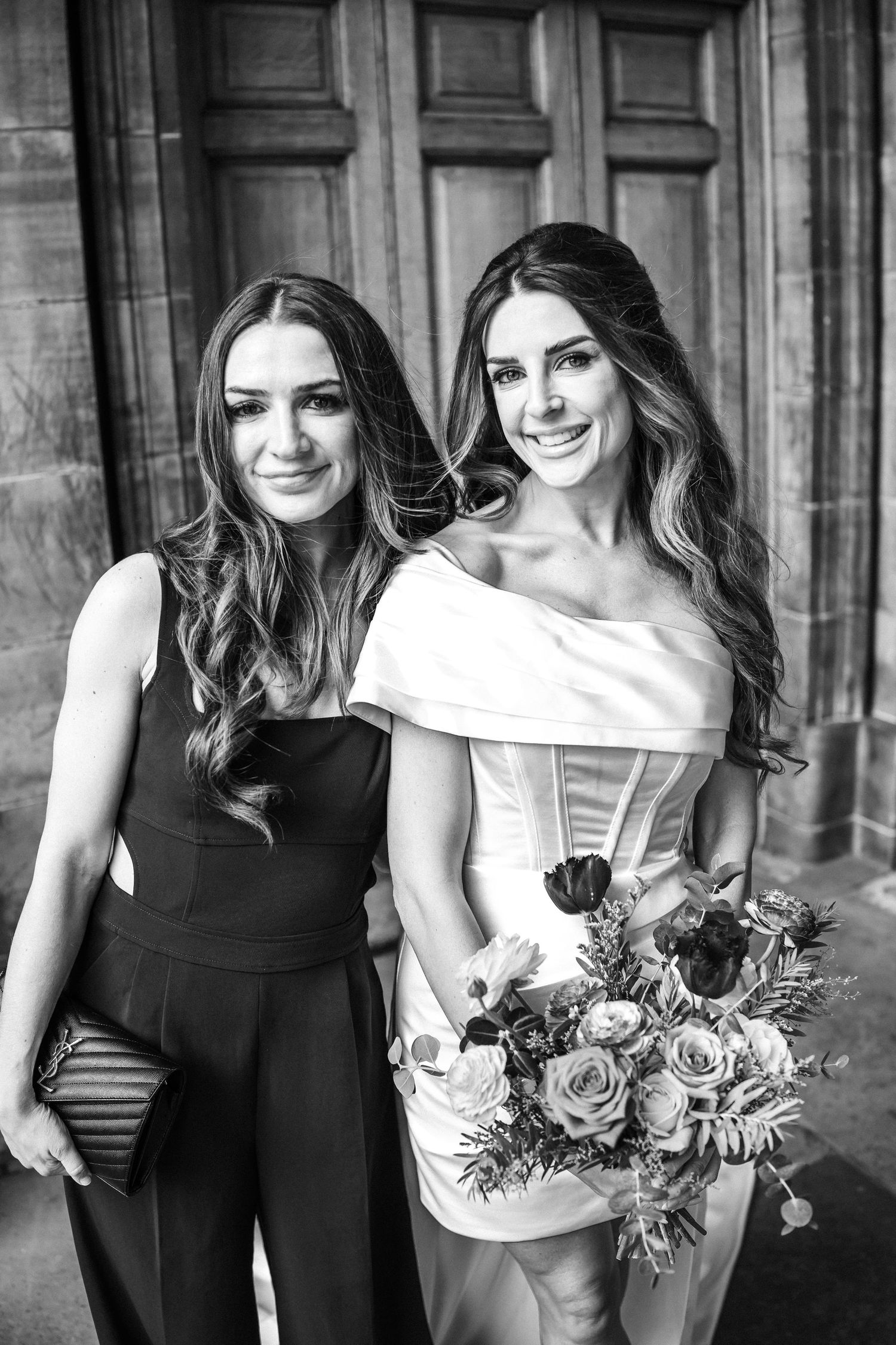 A black and white photo series showing a bridal party holding floral bouquets against a stone wall backdrop.