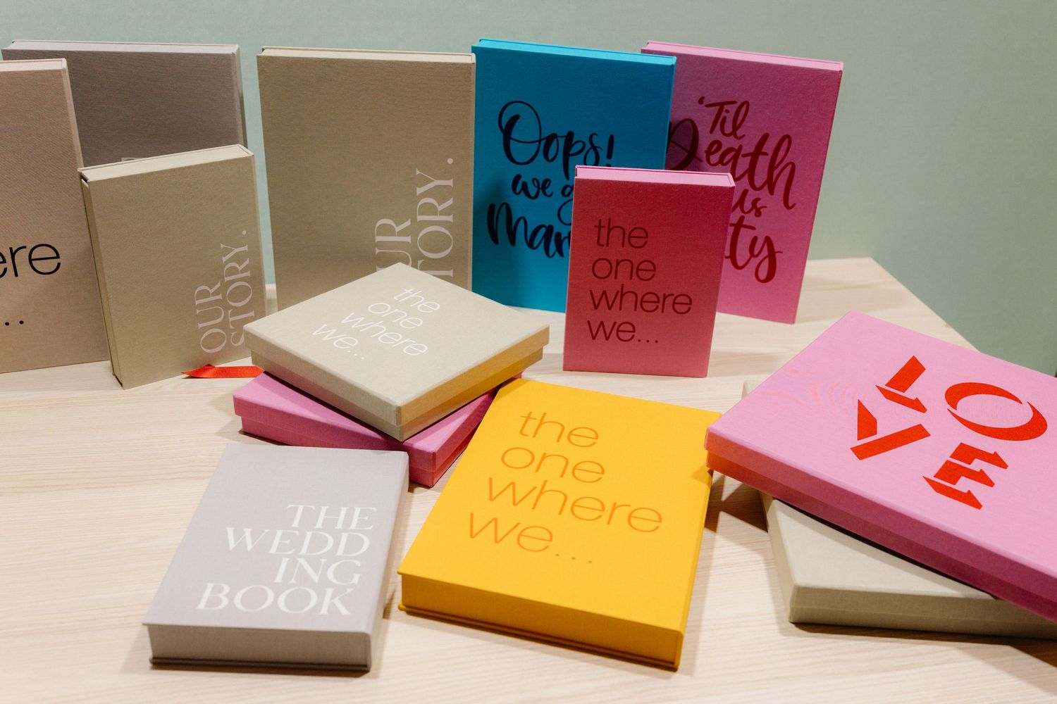 Colorful sticky notes and paper products arranged in a neat row display creative office supplies and stationery items.