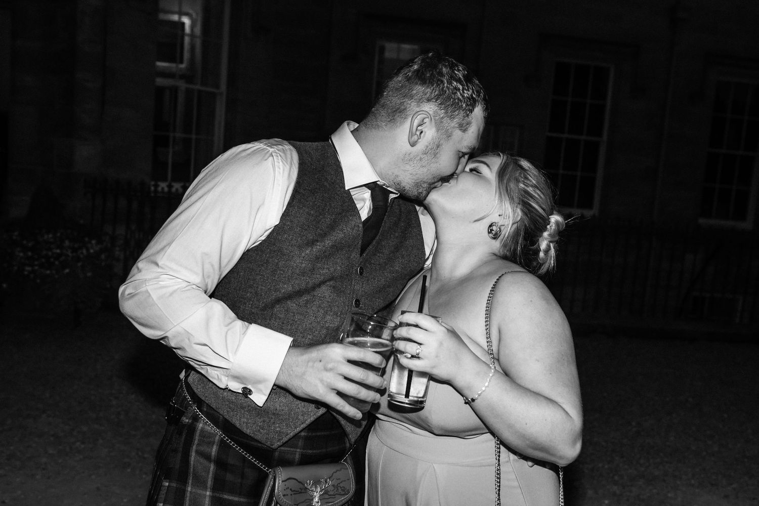 Black and white candid photos of wedding reception dancing and celebrations.