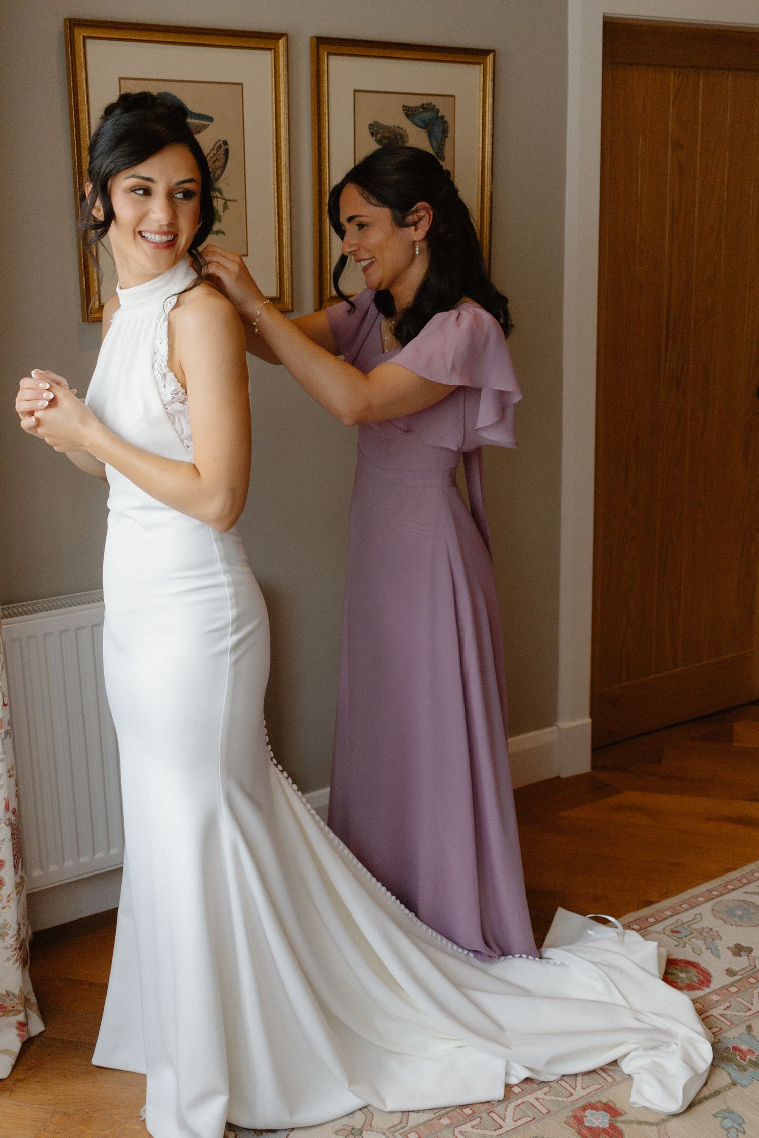 Wedding dress preparations showing elegant white gown with flowing train.