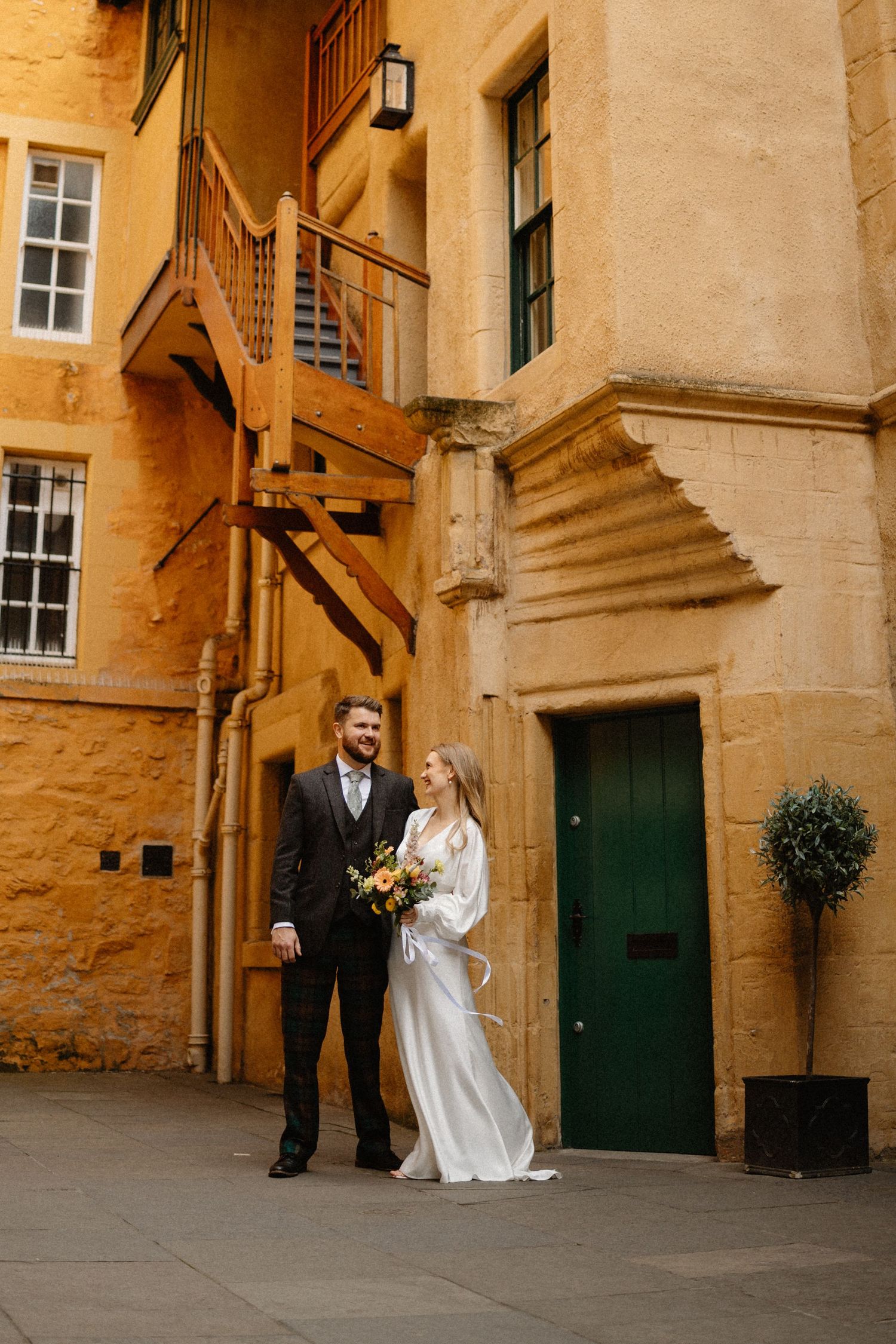 Wedding photos outside Riddles Court venue in Edinburgh