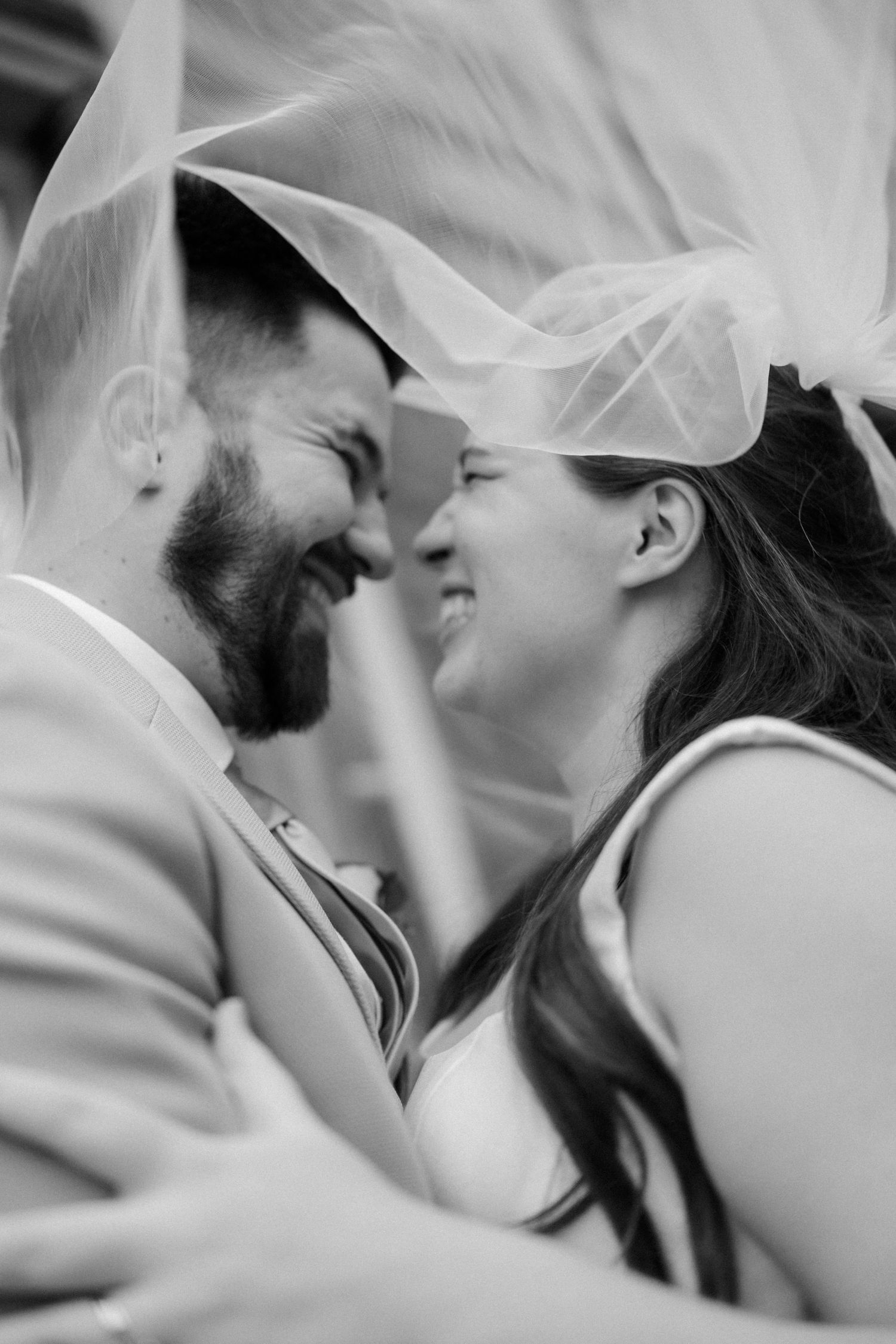 A romantic black and white photo series showing a tender intimate moment between a couple.