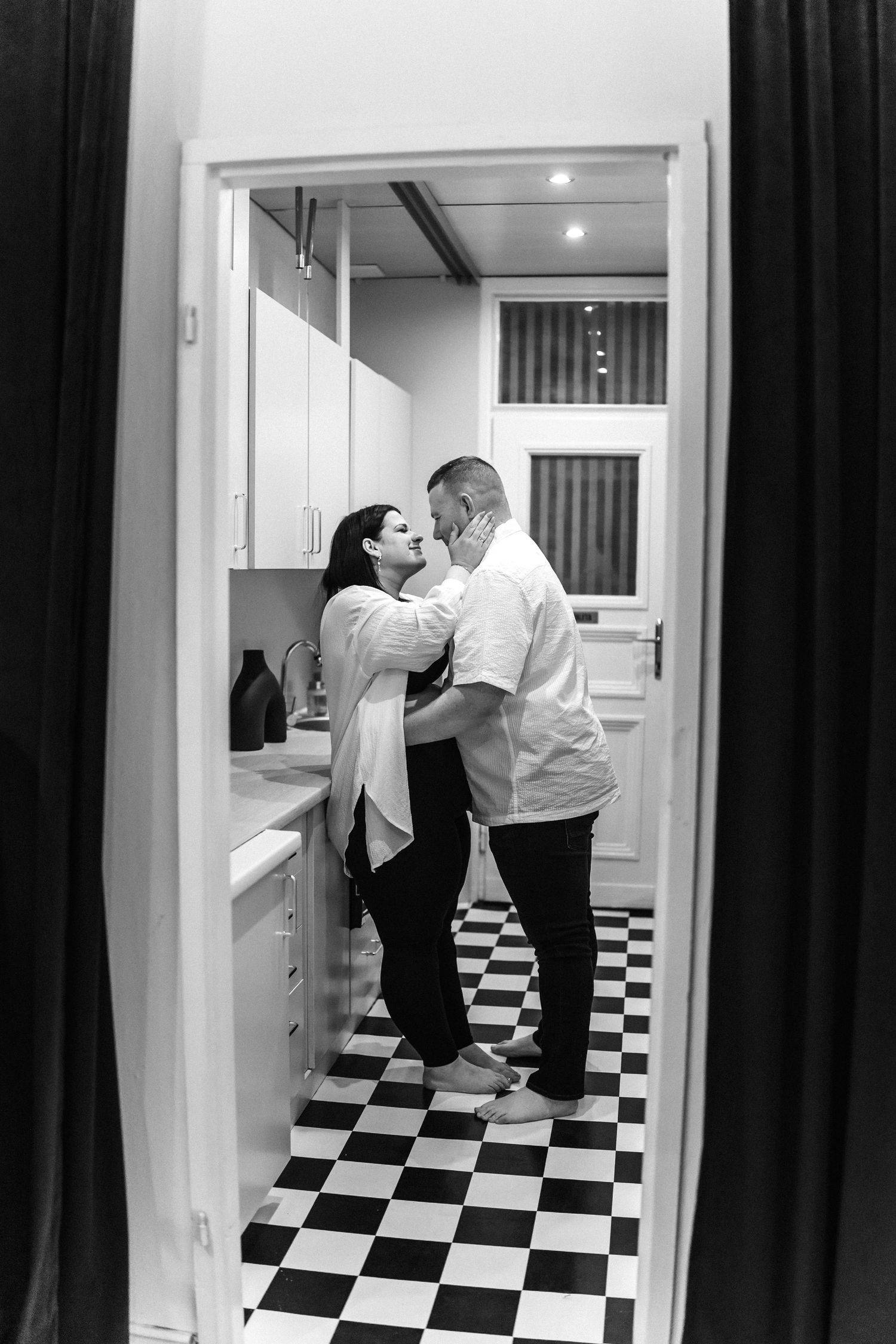 Artistic black and white photo series in a bathroom with checkered floor tiles.