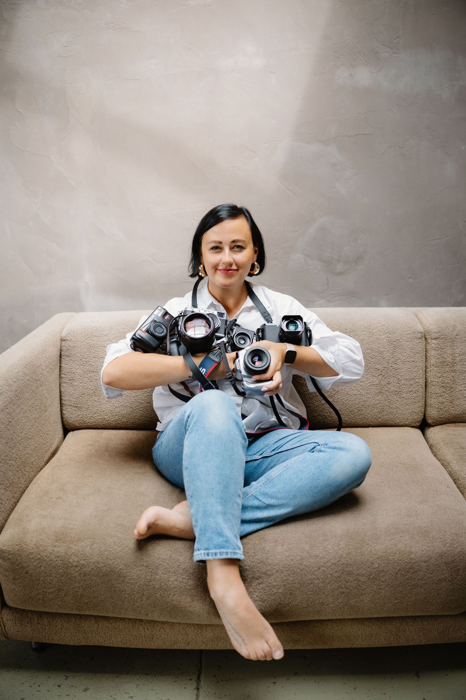 Sequence of photos showing a photographer relaxing with camera equipment on a brown couch.