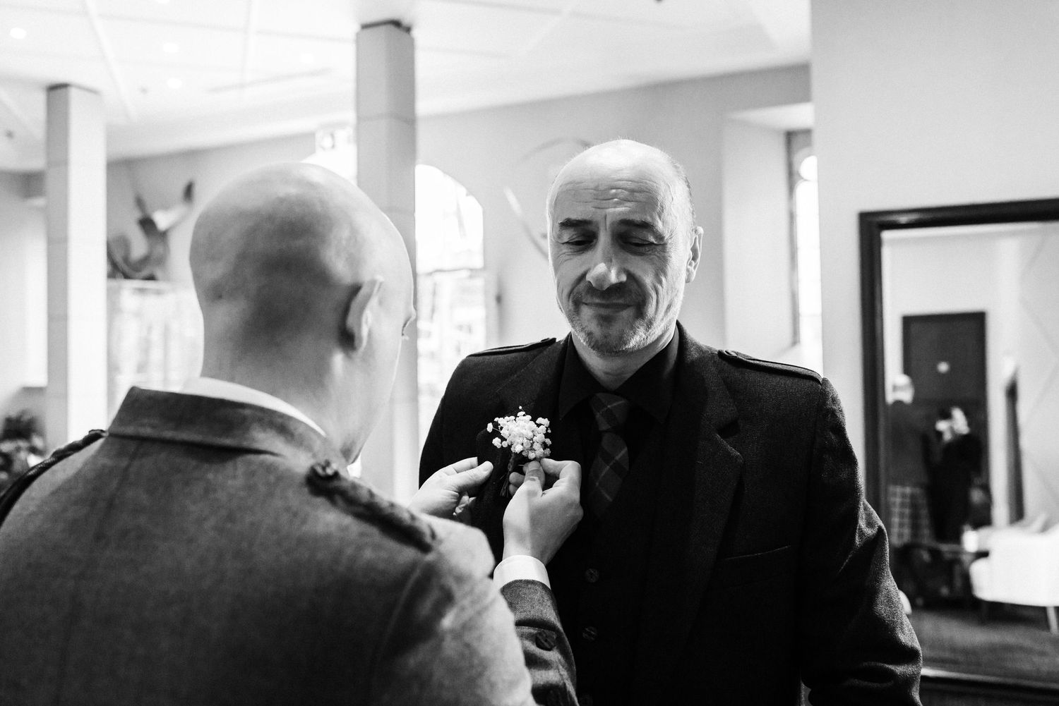 Groom prep, his wedding kilt the Glass House, Edinburgh, Scotland
