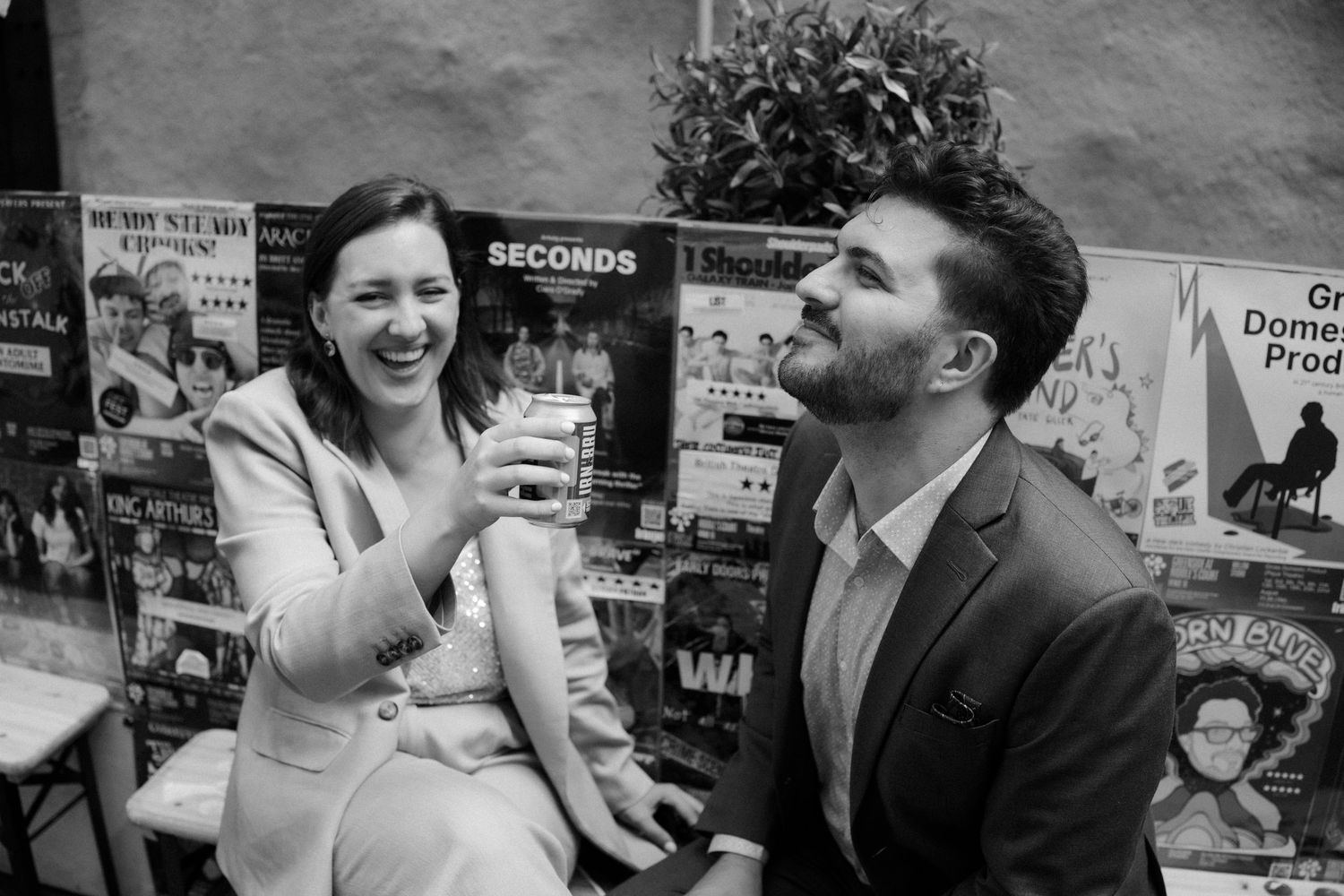 Bride and Groom drinking irn bru, black and white photos city photos on in Edinburgh Scotland