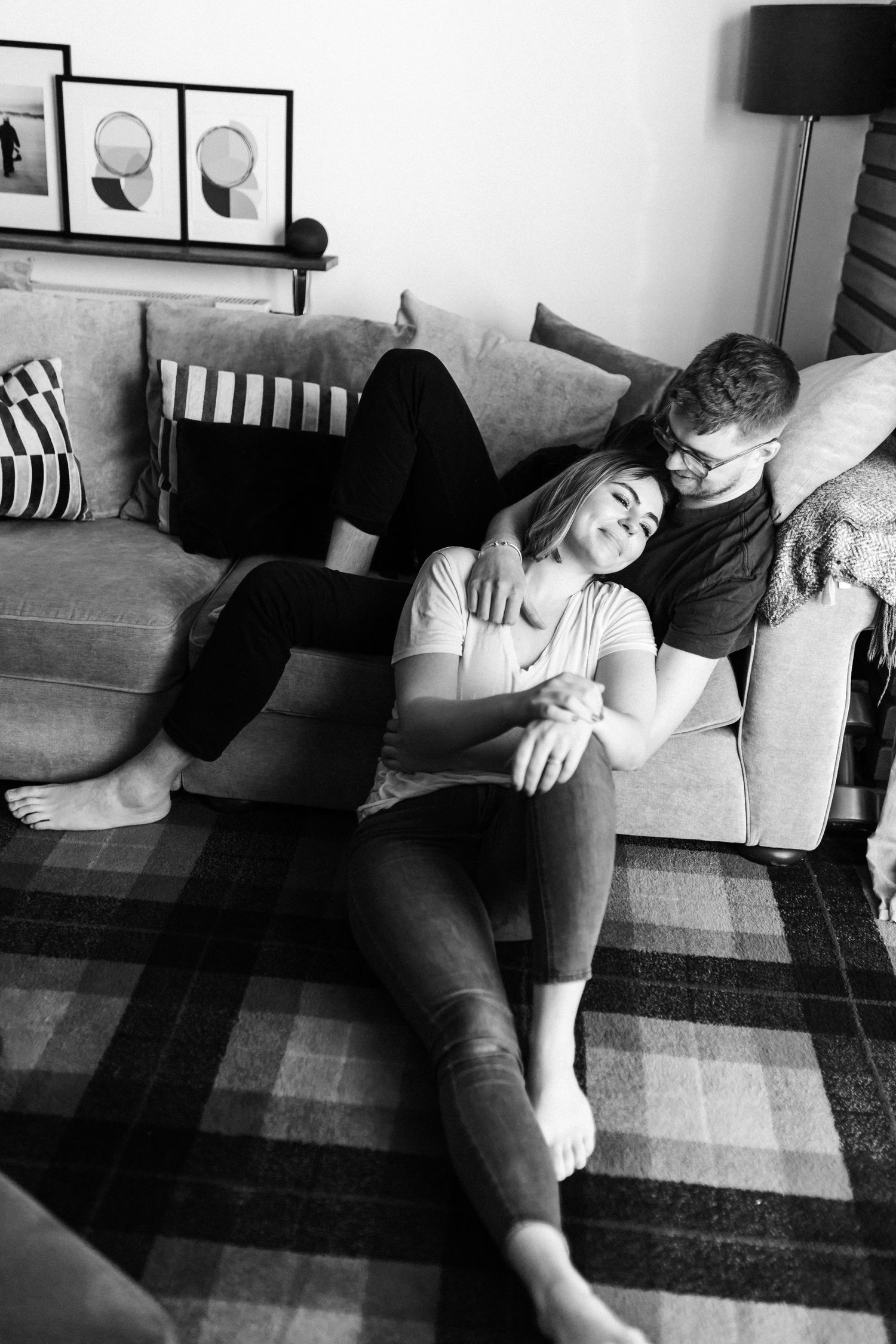 Casual lifestyle photos of a couple relaxing together on a gray couch.