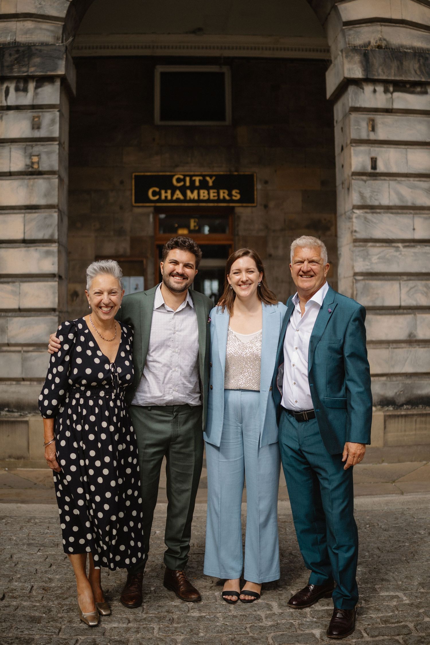 outside the Edinburgh City Chambers 
Edinburgh City Wedding photo bride groom with parents