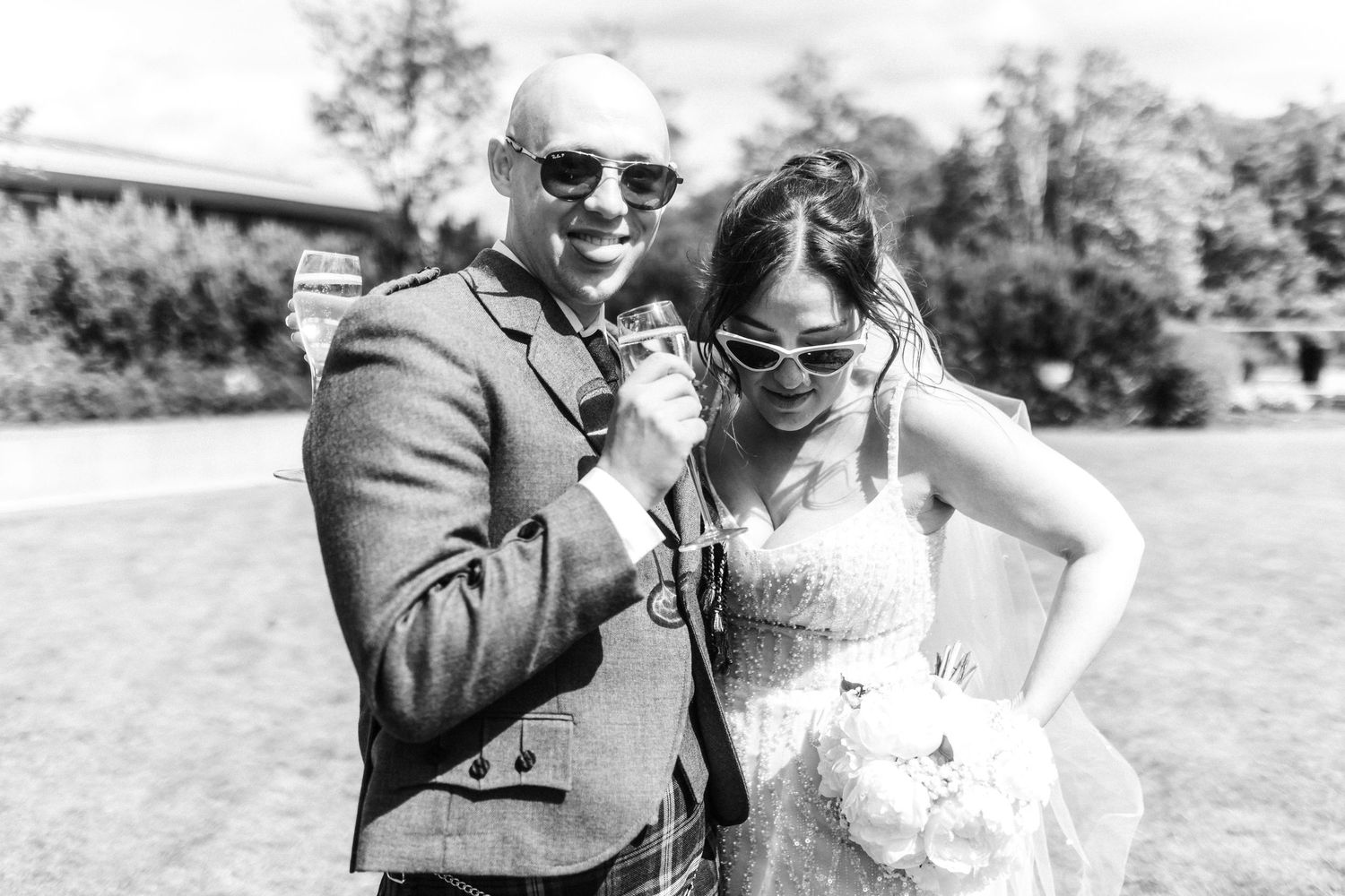 Bride and groom drinking outside of the Glass House, Edinburgh, Scotland.