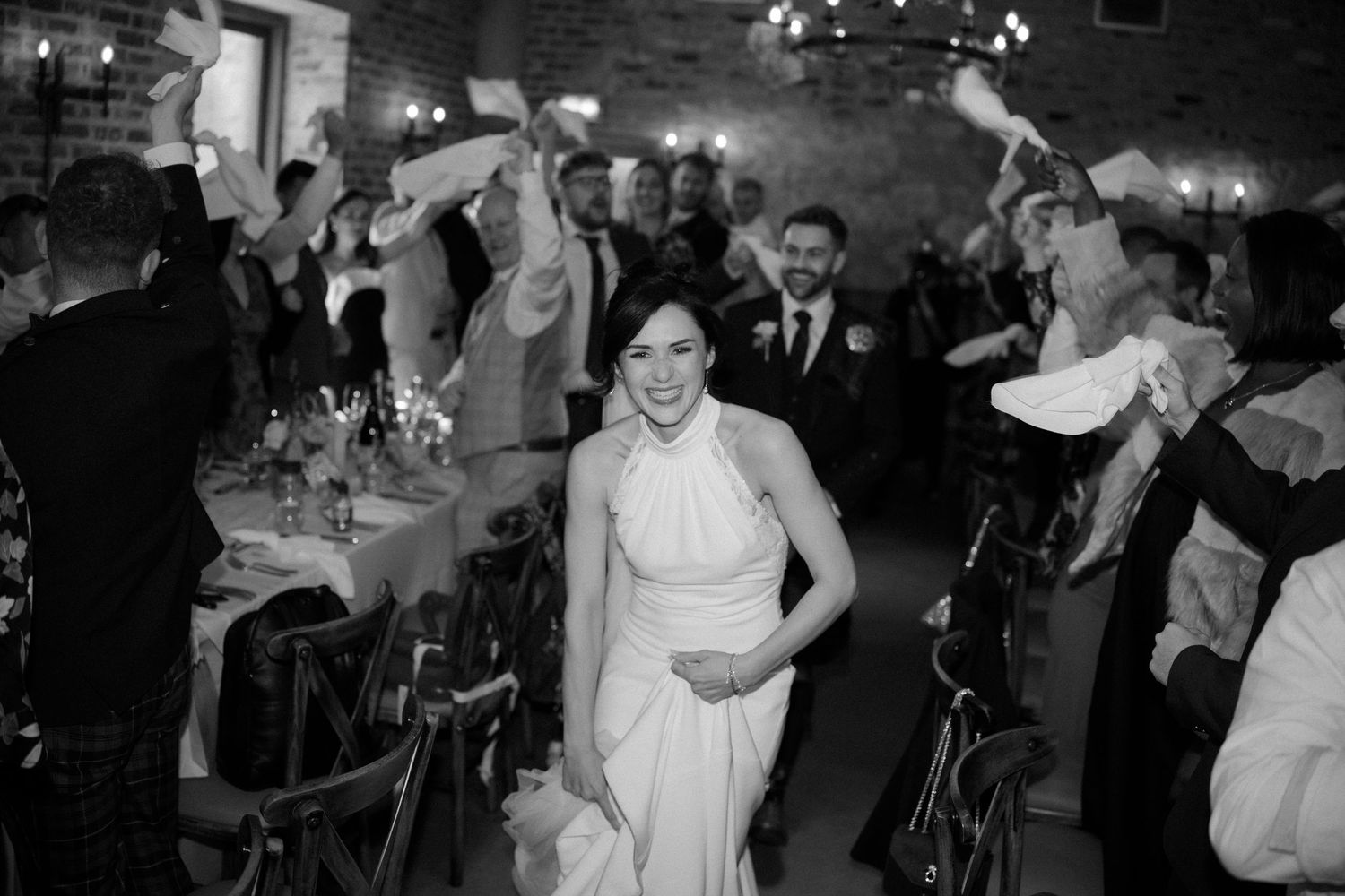 Wedding reception dance floor filled with joyful celebration and movement.