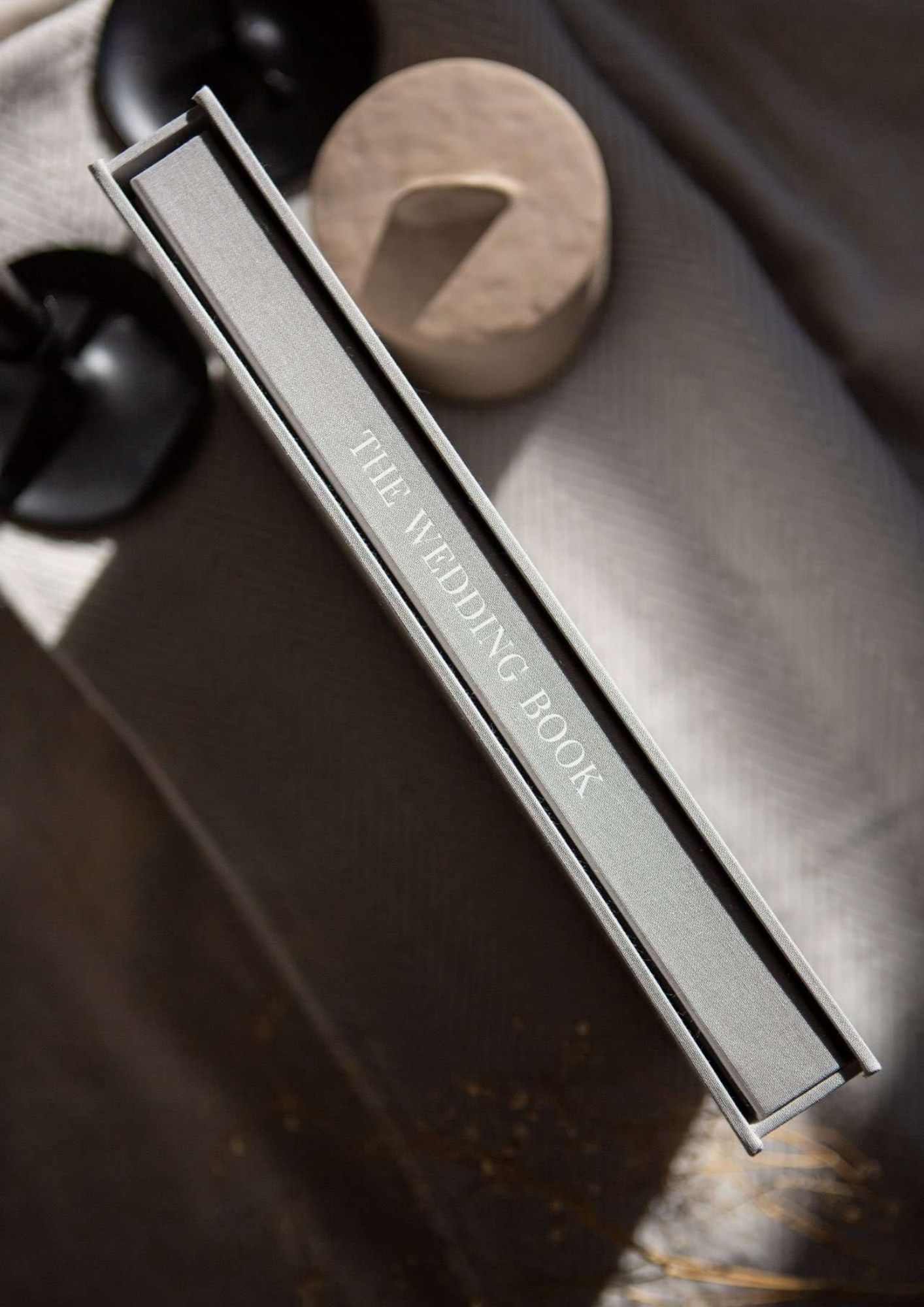 Close-up macro shots showing a silver metal edge or knife blade with fine detail and texture in dramatic lighting.