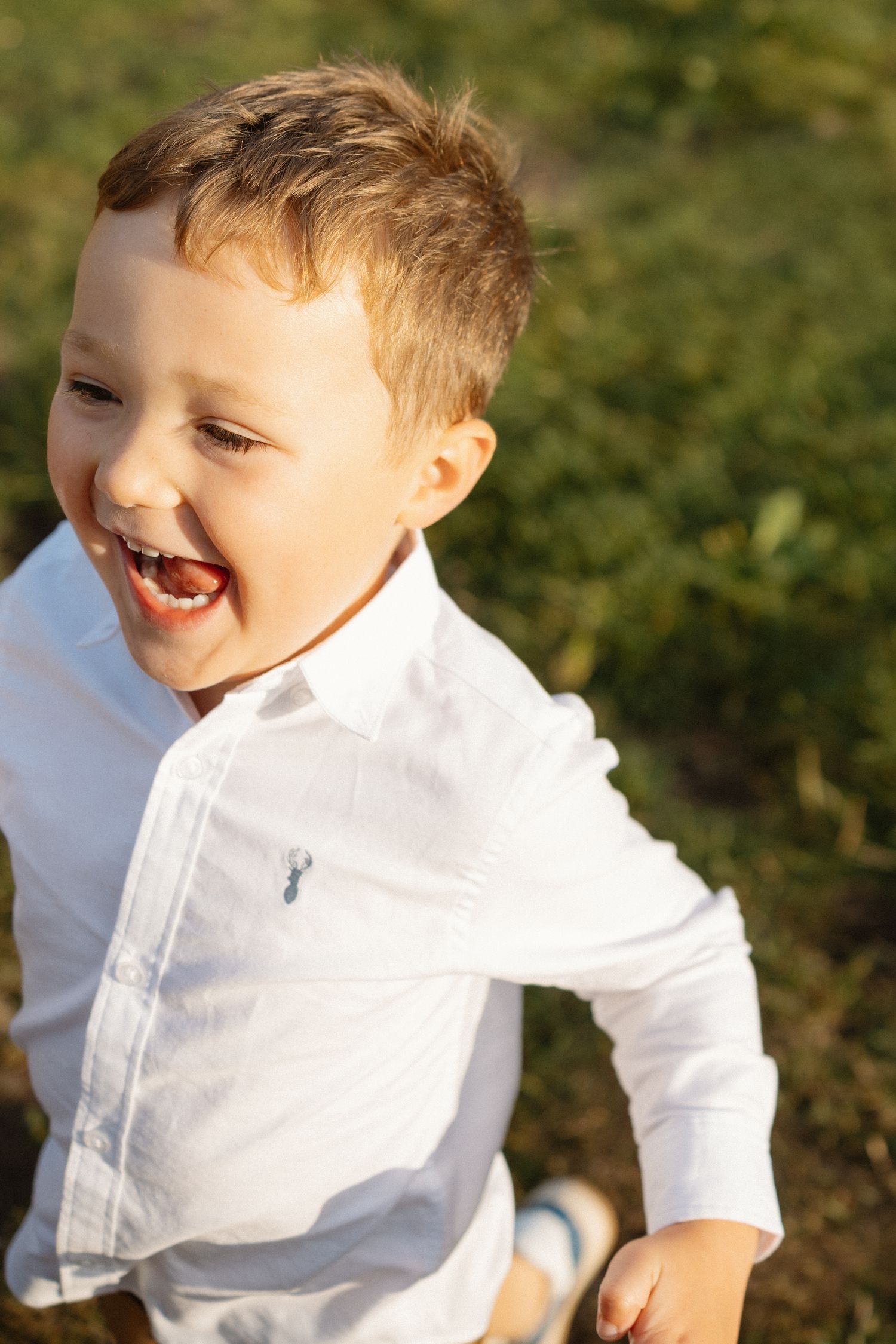 Close-up of joyful laughter in bright sunlight.