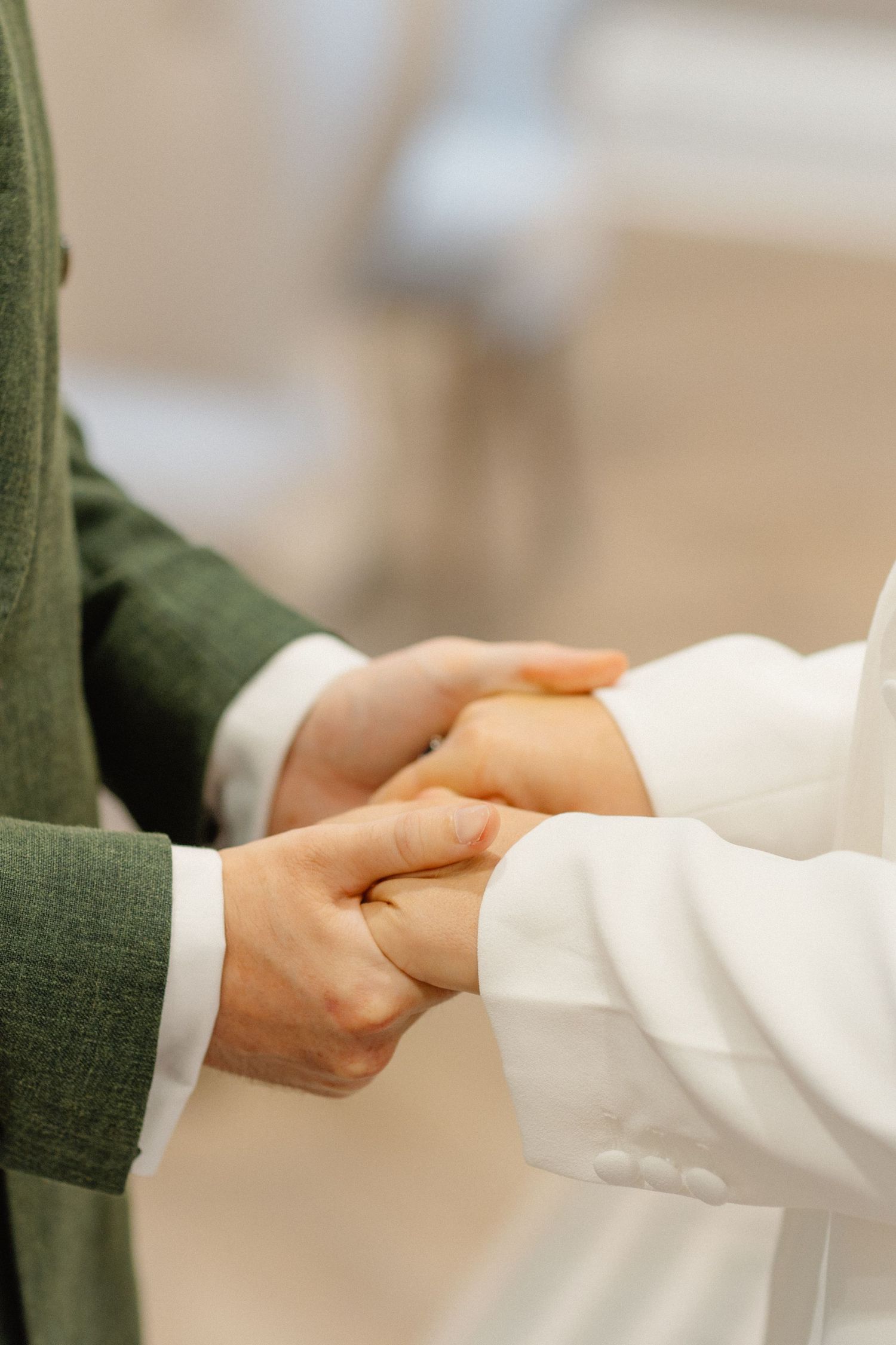 A sequence of five images showing two hands in a business handshake against a light background.