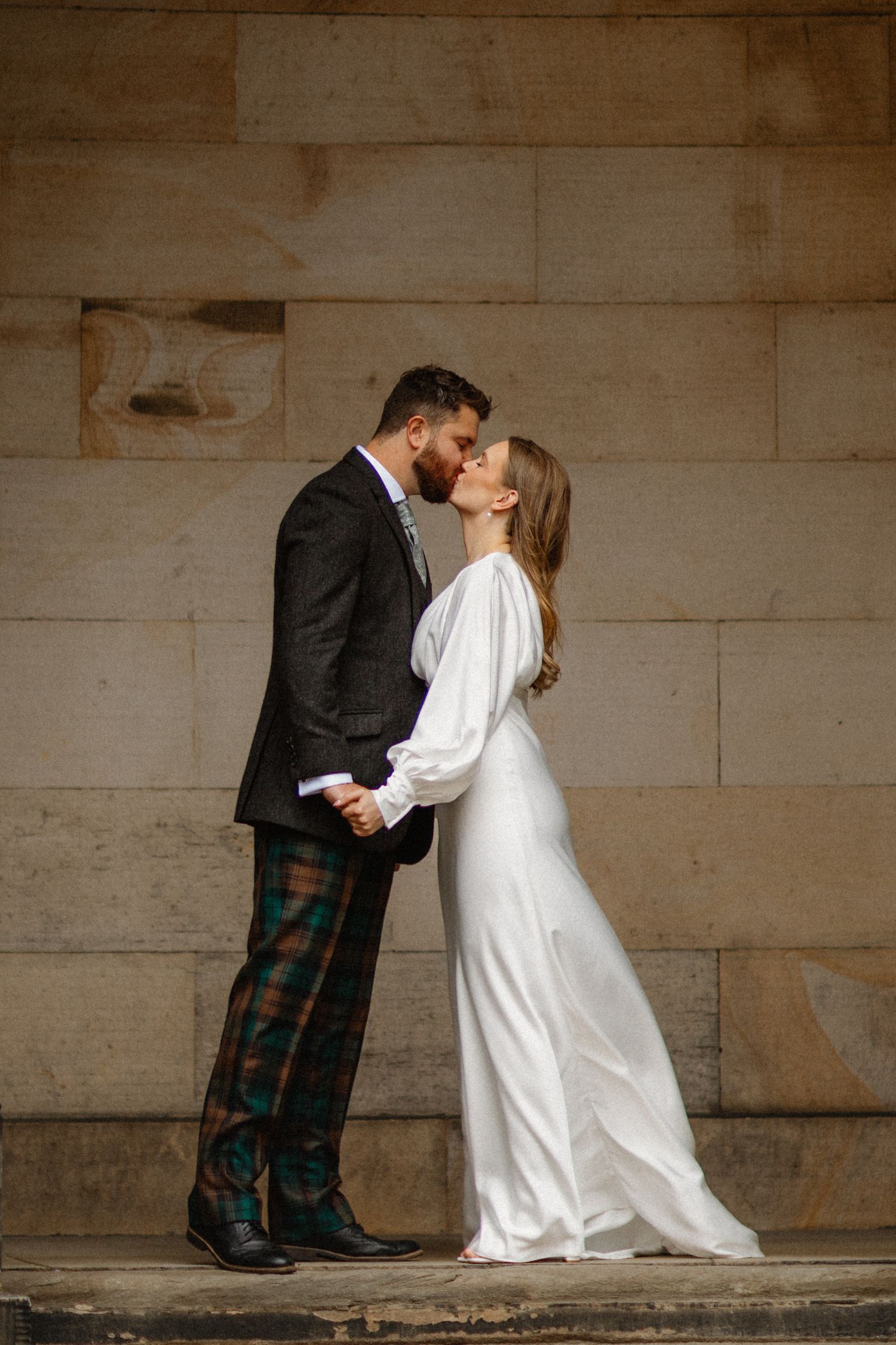 Kissing bride and groom Wedding photos Edinburgh Scotland