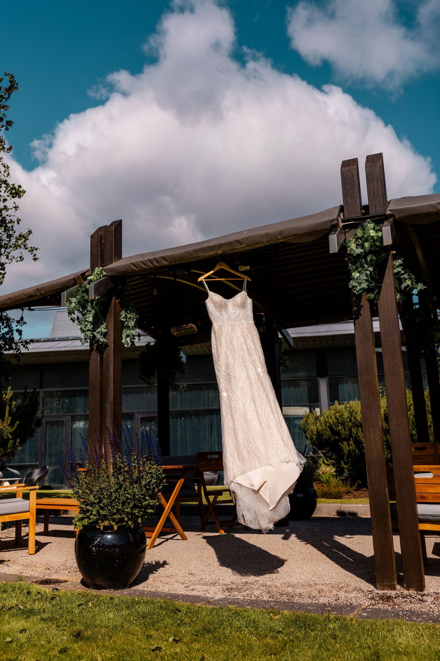 wedding dress in the wind outside of the Glass House, Edinburgh, Scotland