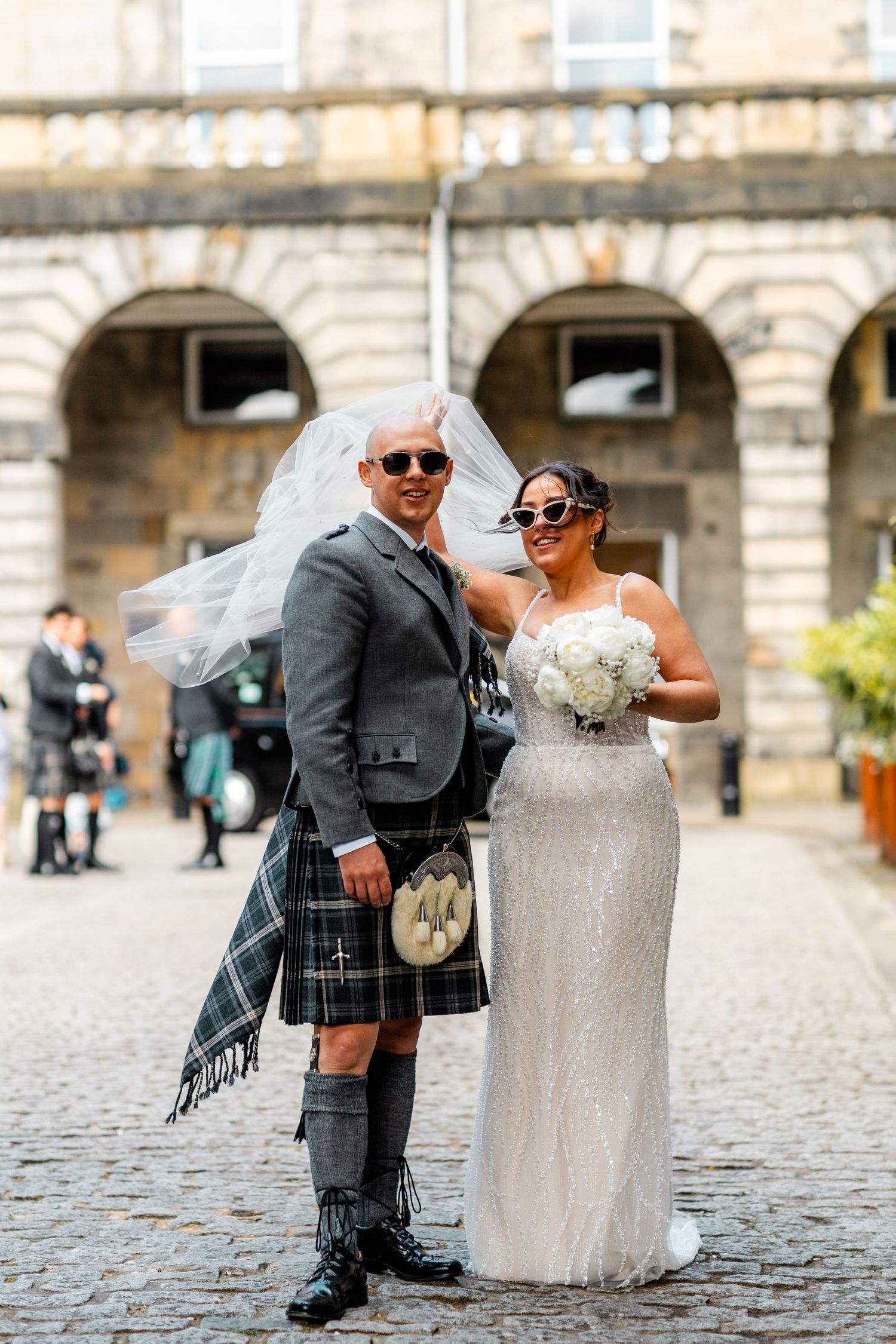 Bride and groom outside City Chambers wedding in Edinburgh, Scotland,