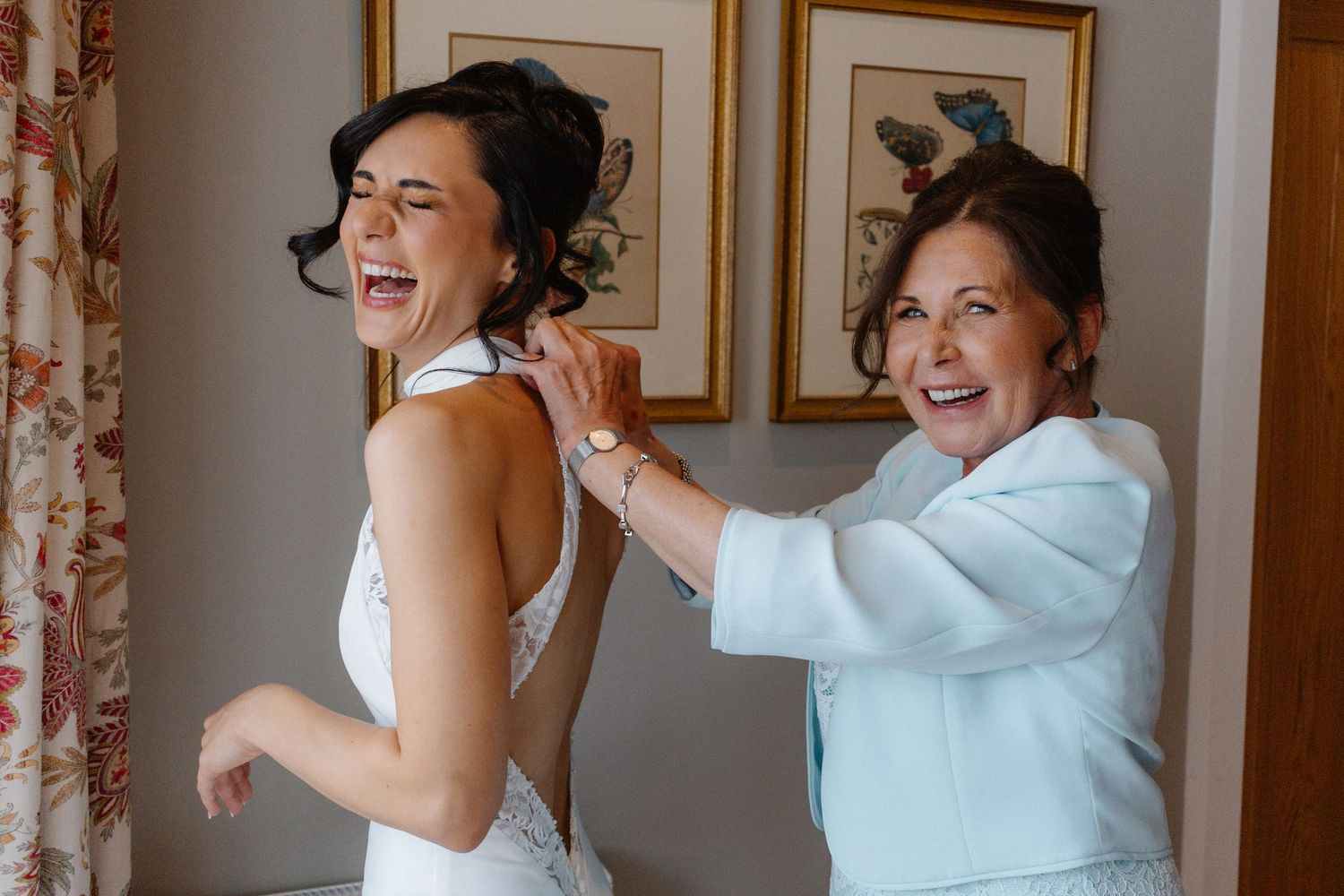 Bride getting ready with mum Wedding at Rosebery Steading, Temple, Gorebridge, Scotland.