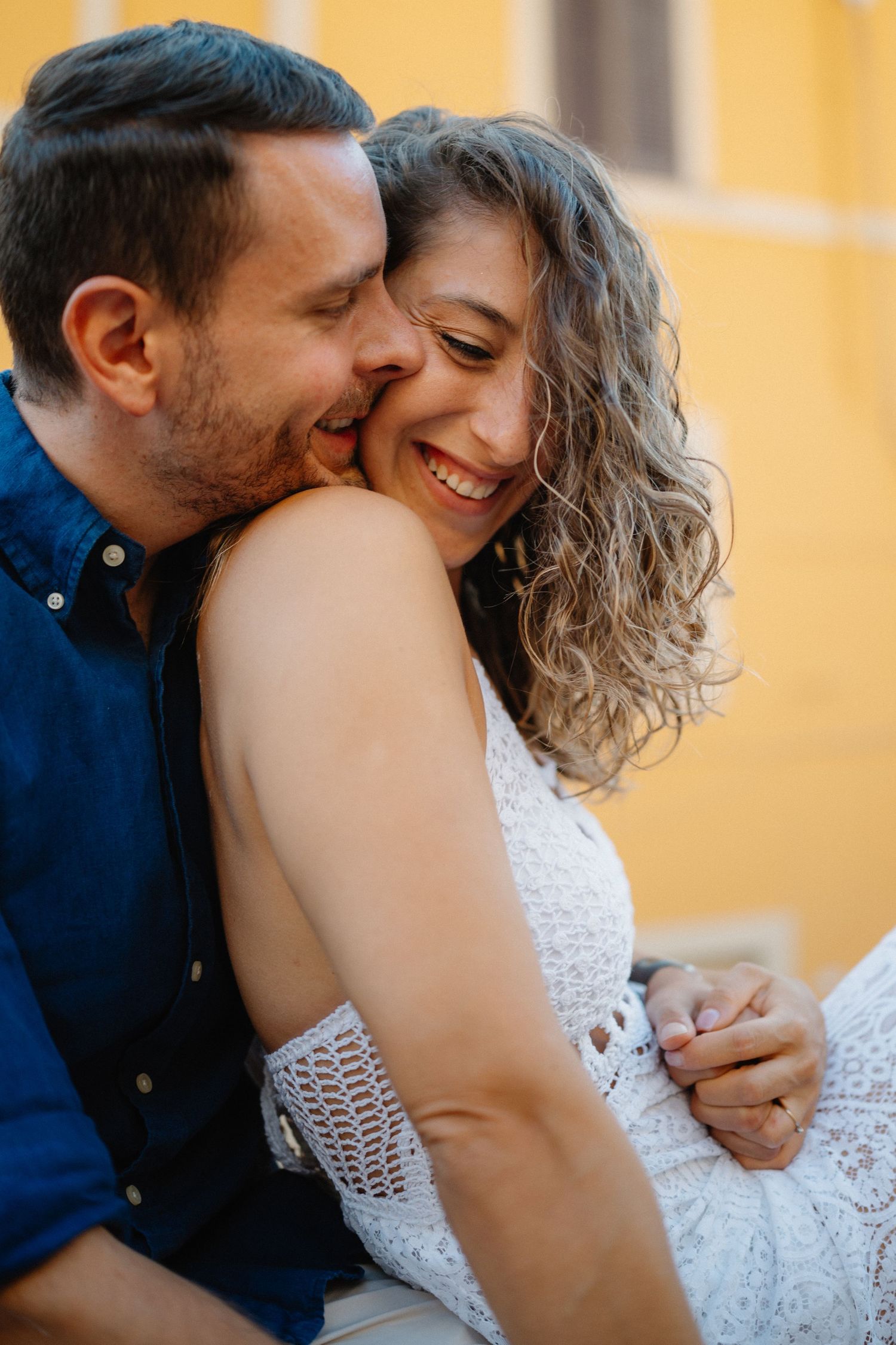 Romantic couple sharing intimate moments in a series of close-up shots against a warm yellow background.