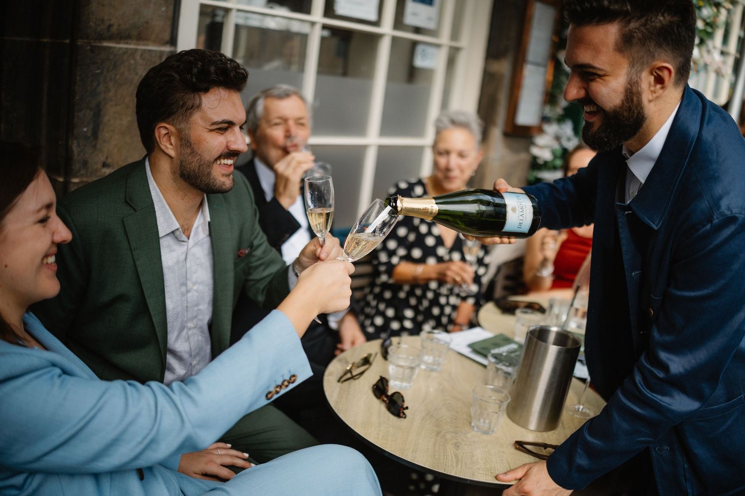Wedding celebration with a glass of fizz in Scotts Restaurant in Edinburgh Scotland