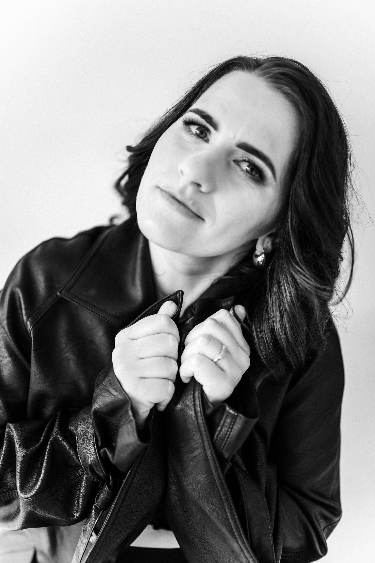Black and white close-up portraits showing dramatic angles and expressions.