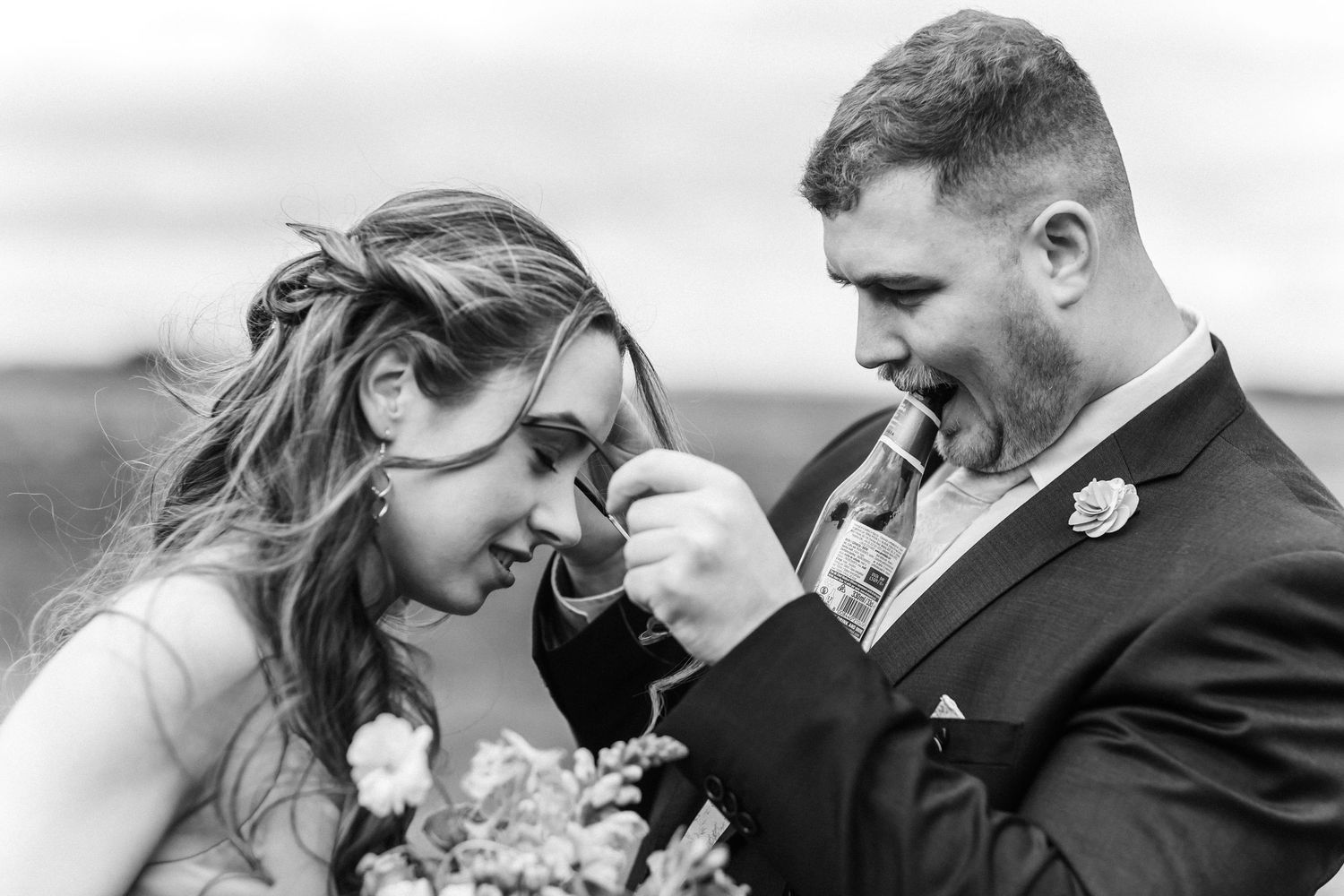 Intimate black and white portraits showing tender moments outdoors.