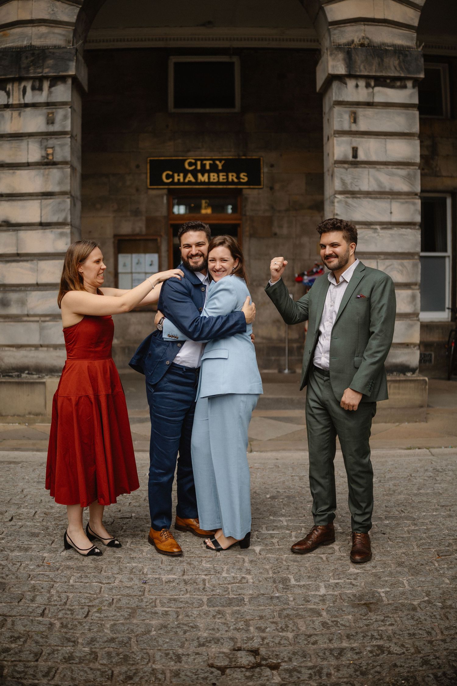 outside the Edinburgh City Chambers  
fun photo of twins with partners
Edinburgh City Wedding photo
