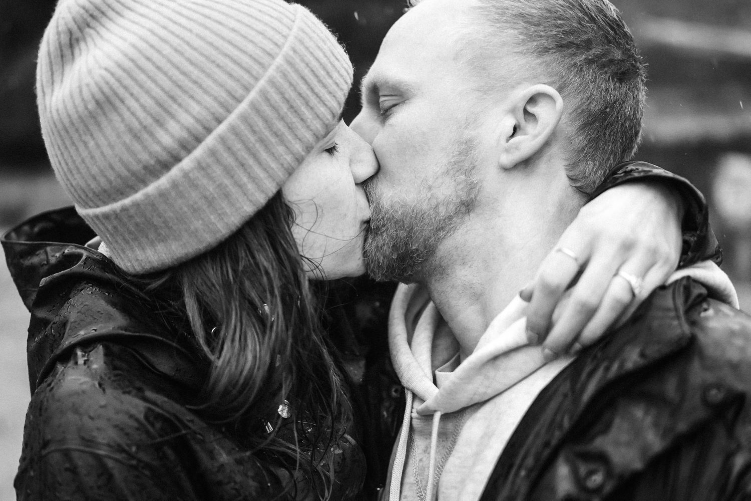 A tender romantic moment shared between two people on a cold day.