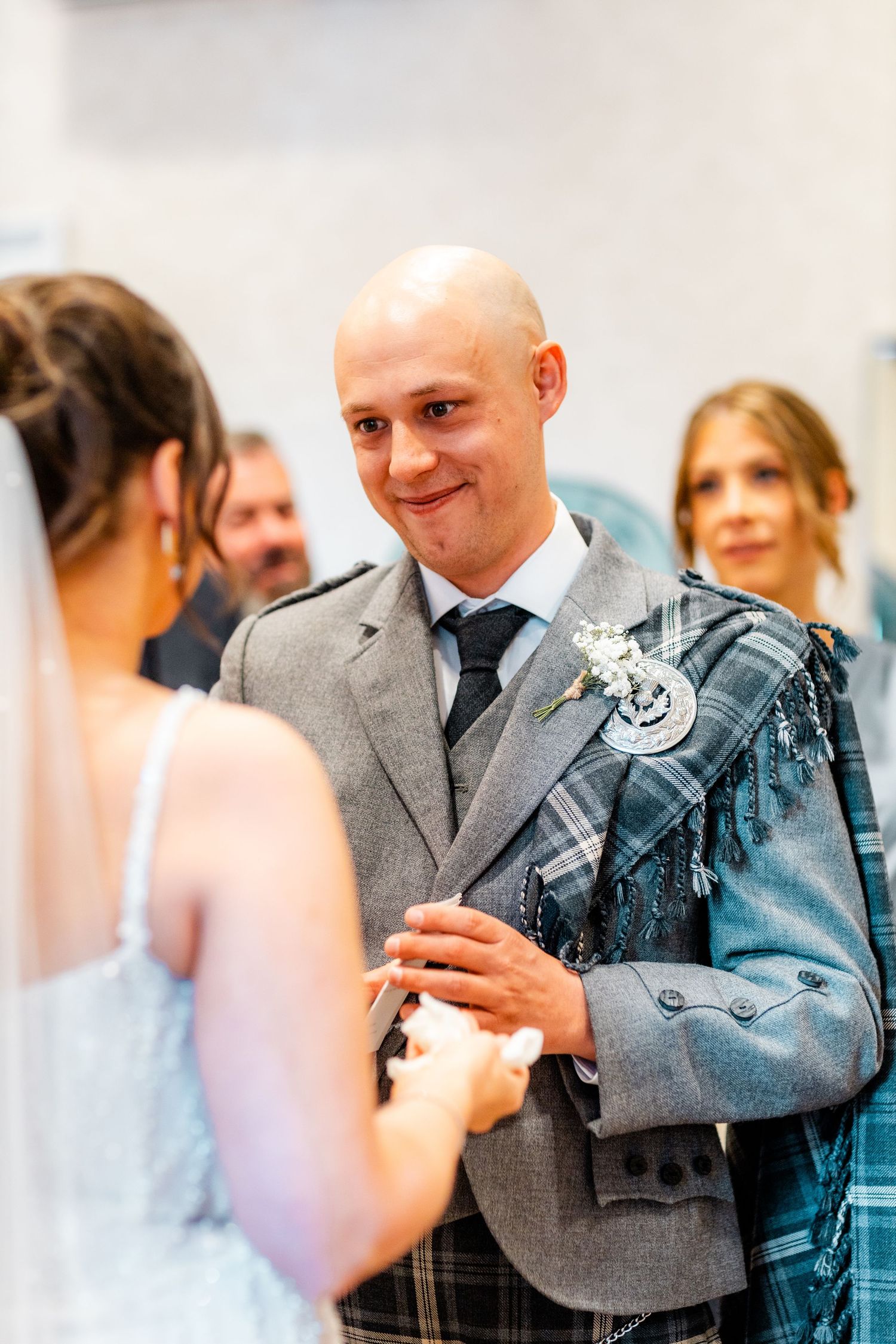 Groom looking at the bride, Married couple City Chambers wedding in Edinburgh, Scotland,