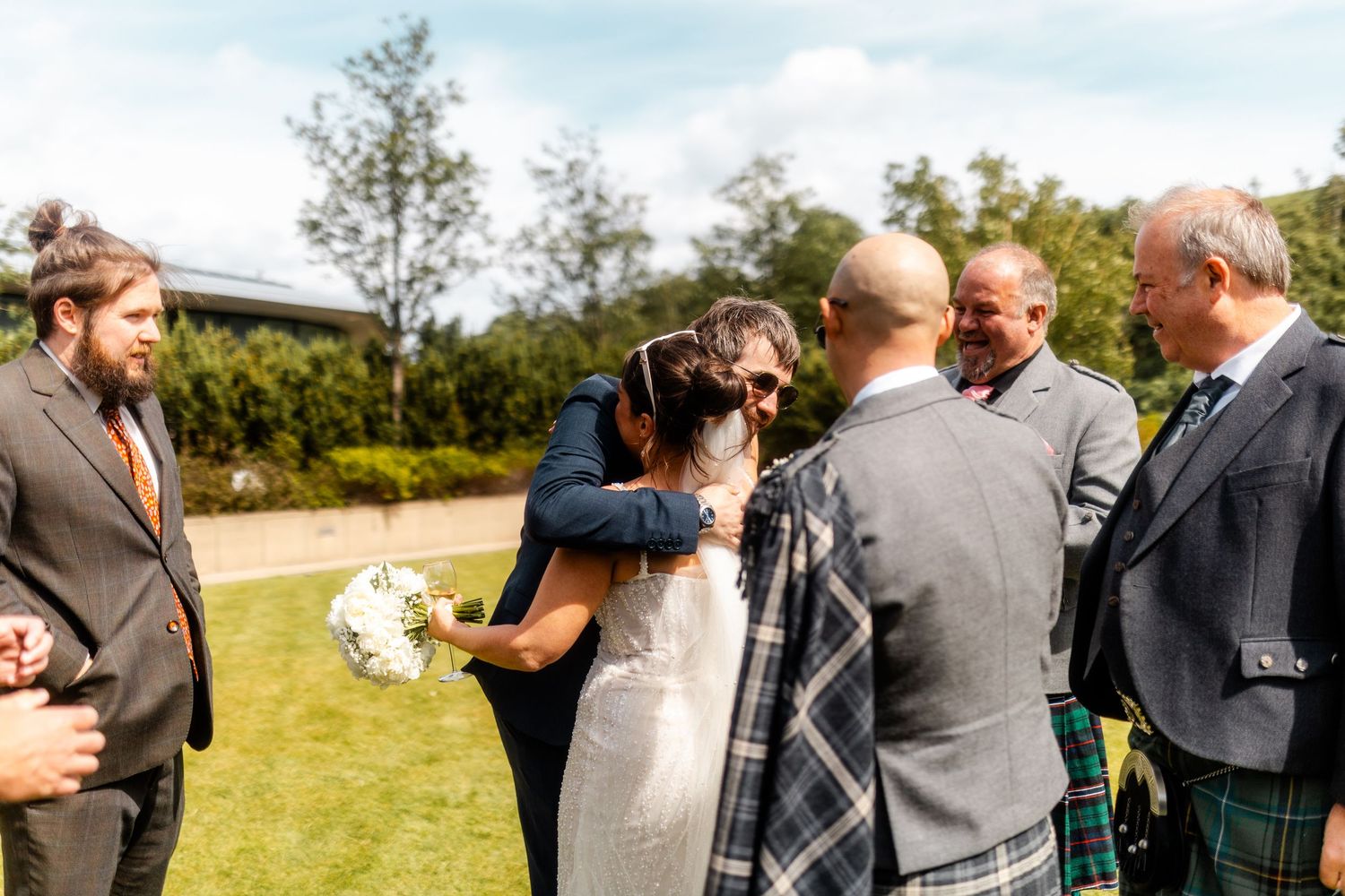 Bride with the family outside of the Glass House Edinburgh, Scotland.