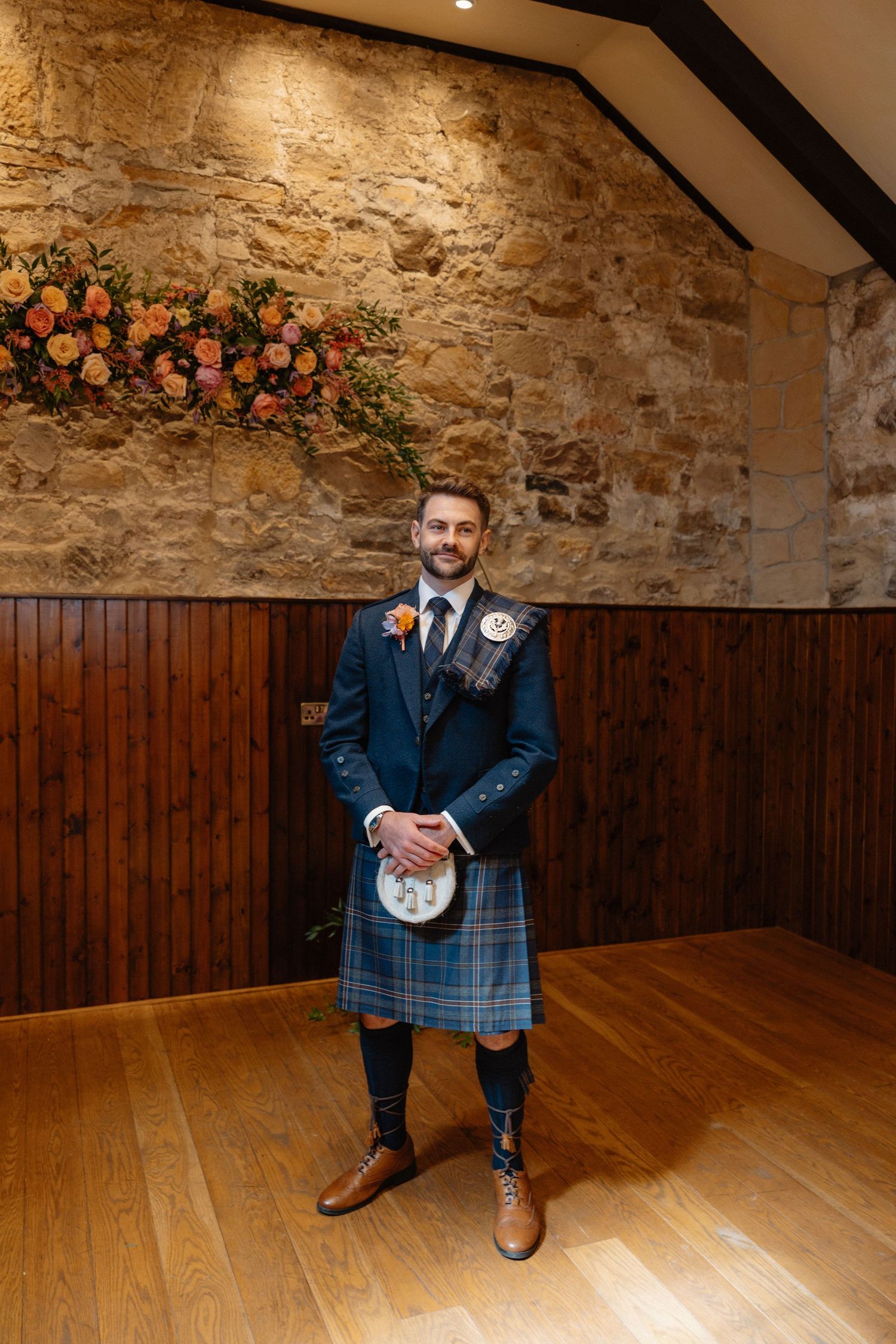 Wedding ceremony, groom waiting for bride at Rosebery Steading, Temple, Gorebridge, Scotland.