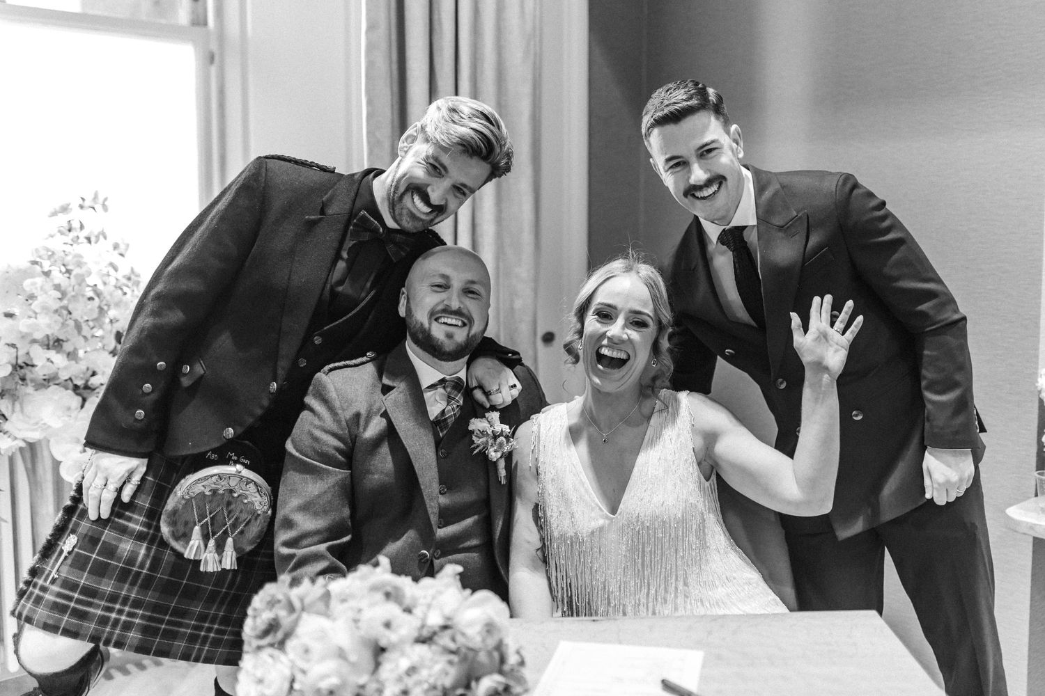 Black and white photos showing candid moments of wedding celebration and laughter.