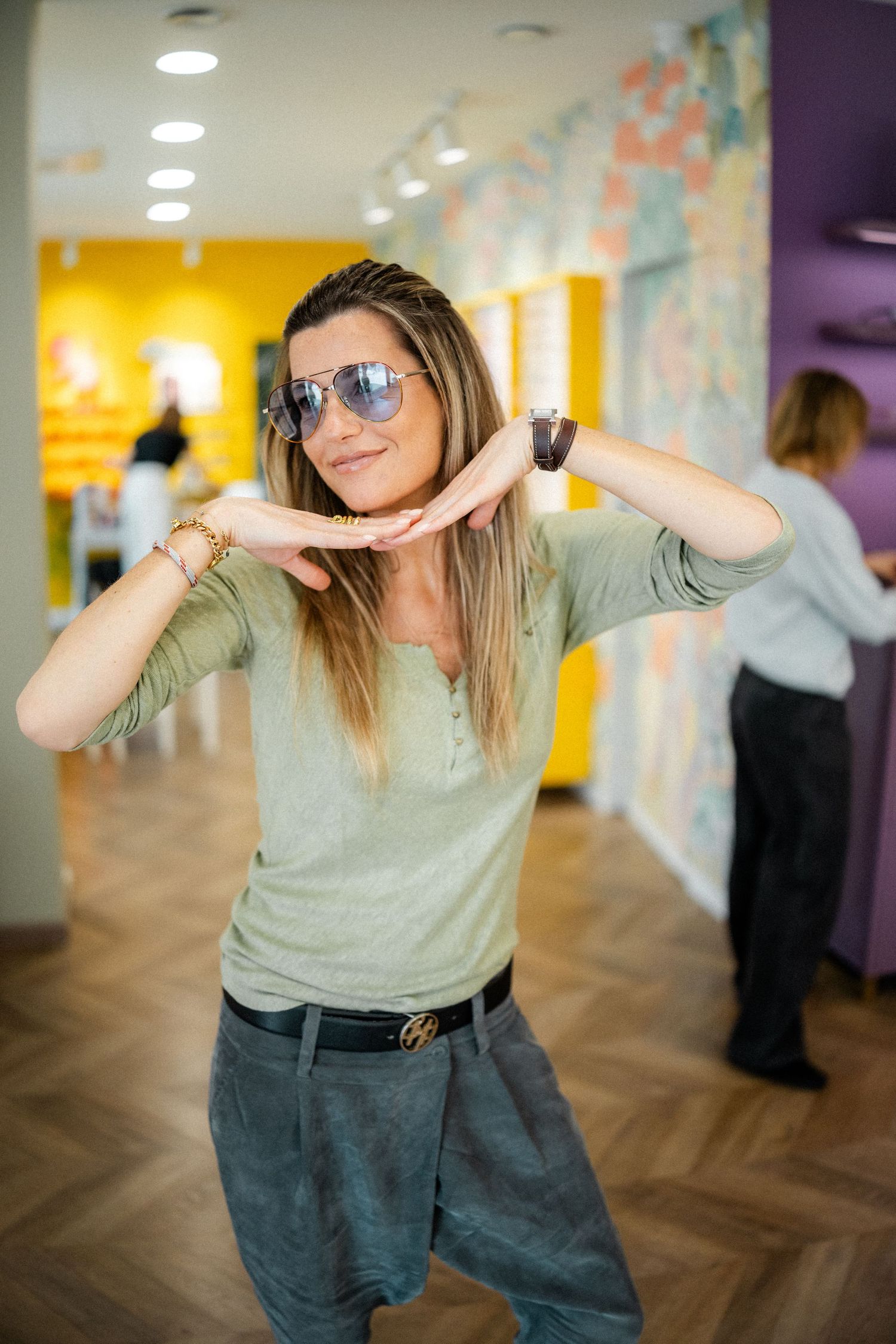 Dancing sequence in an indoor space with colorful wall murals.