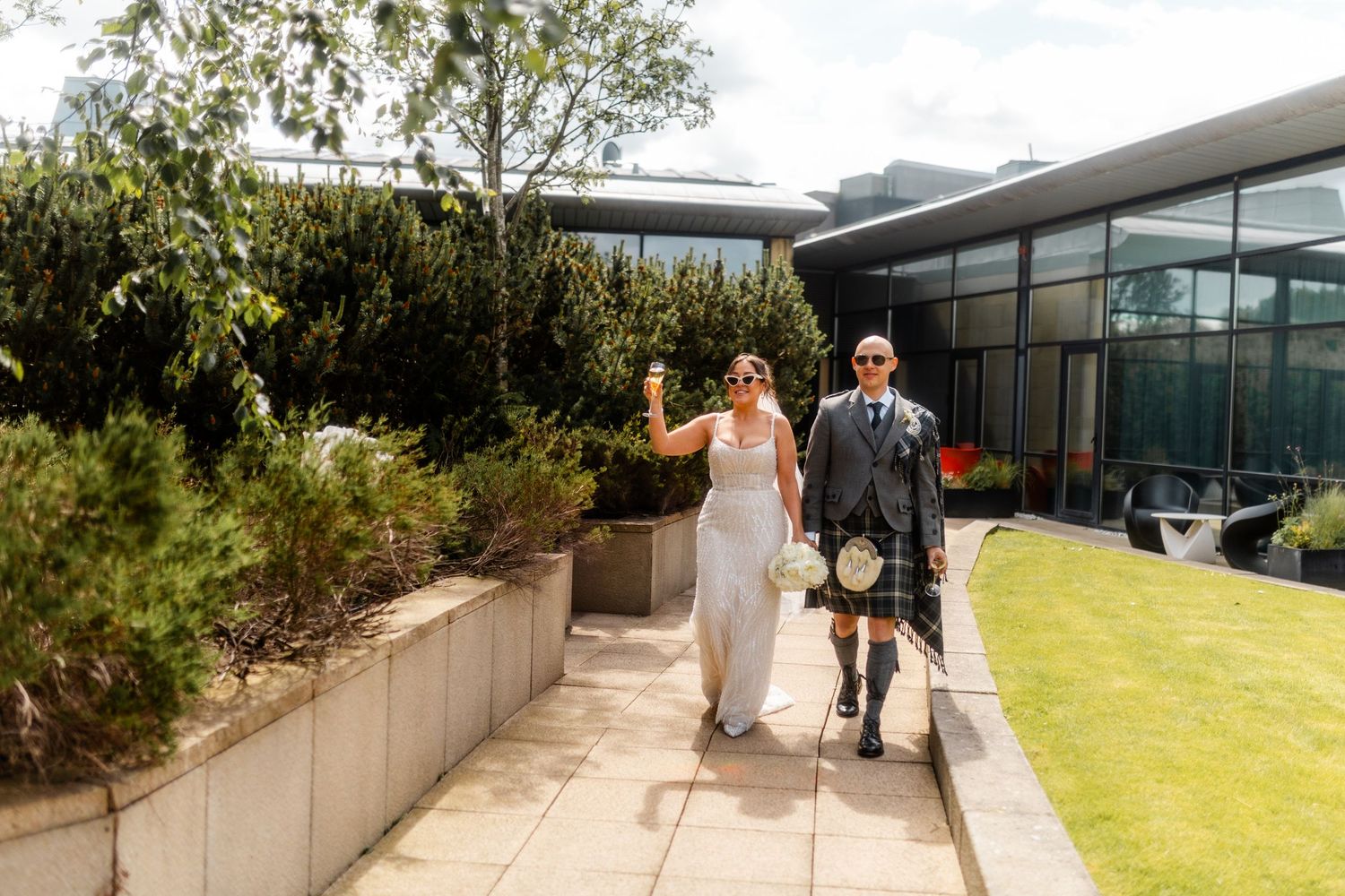 Married couple outside of Glass house Edinburgh, Scotland.