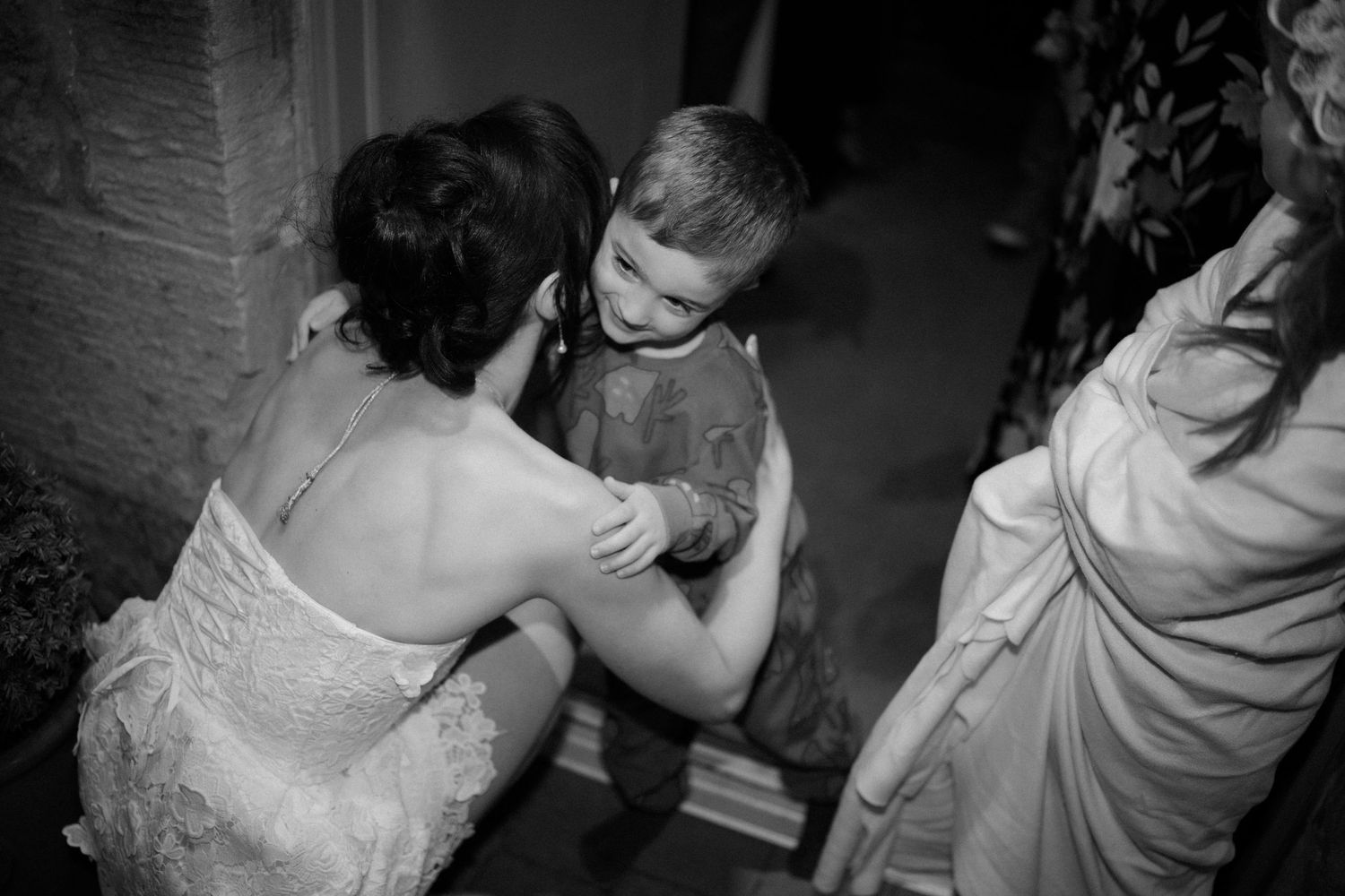 Wedding party, hugs, at Rosebery Steading, Temple, Gorebridge, Scotland.