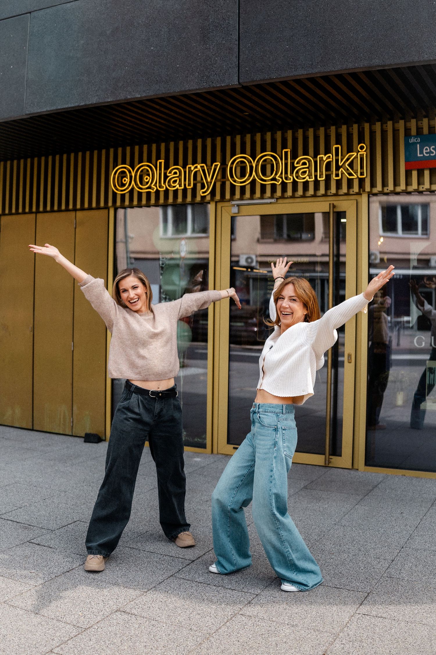 Dynamic dance movements captured in sequence against a commercial storefront.