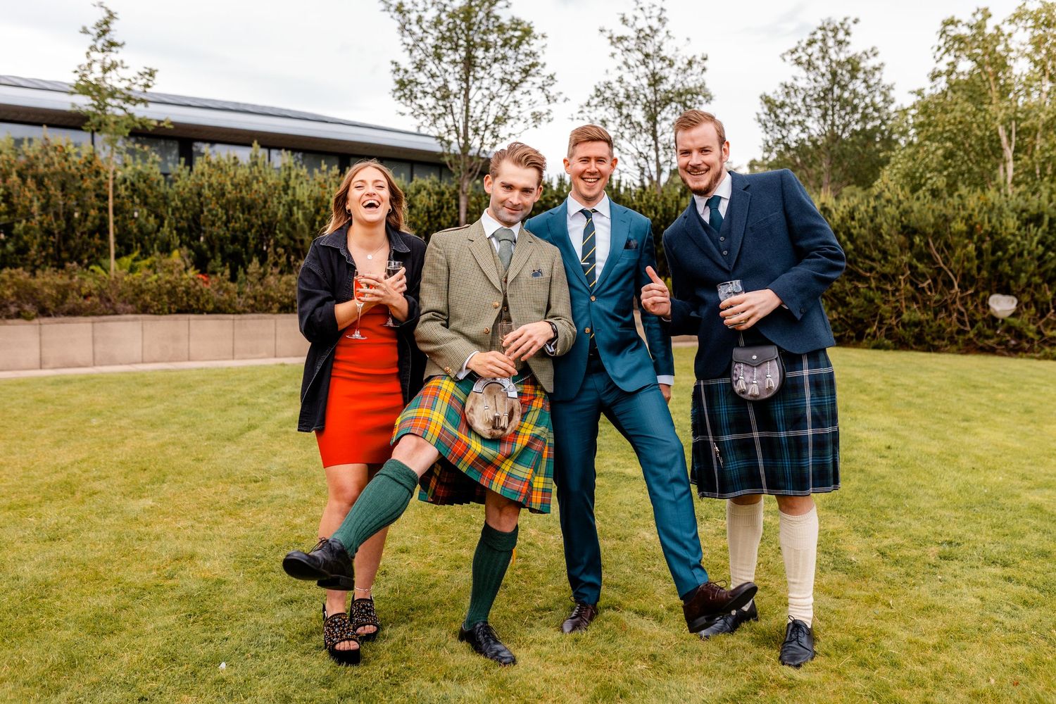 Wedding guests having fun outside of the Glass House, Edinburgh, Scotland.