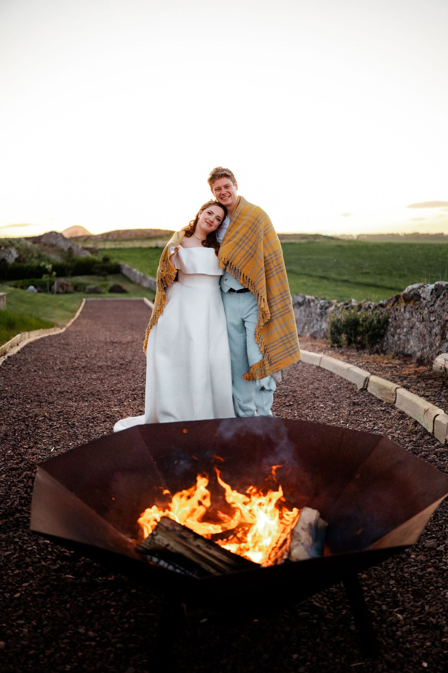 Wedding bride and groom photos by fire pit, Whitekirk Hill, Whitekirk, North Berwick