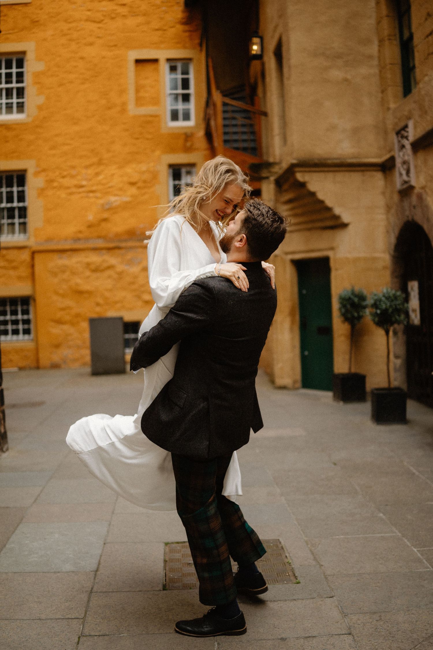 Wedding photos outside Riddles Court venue in Edinburgh