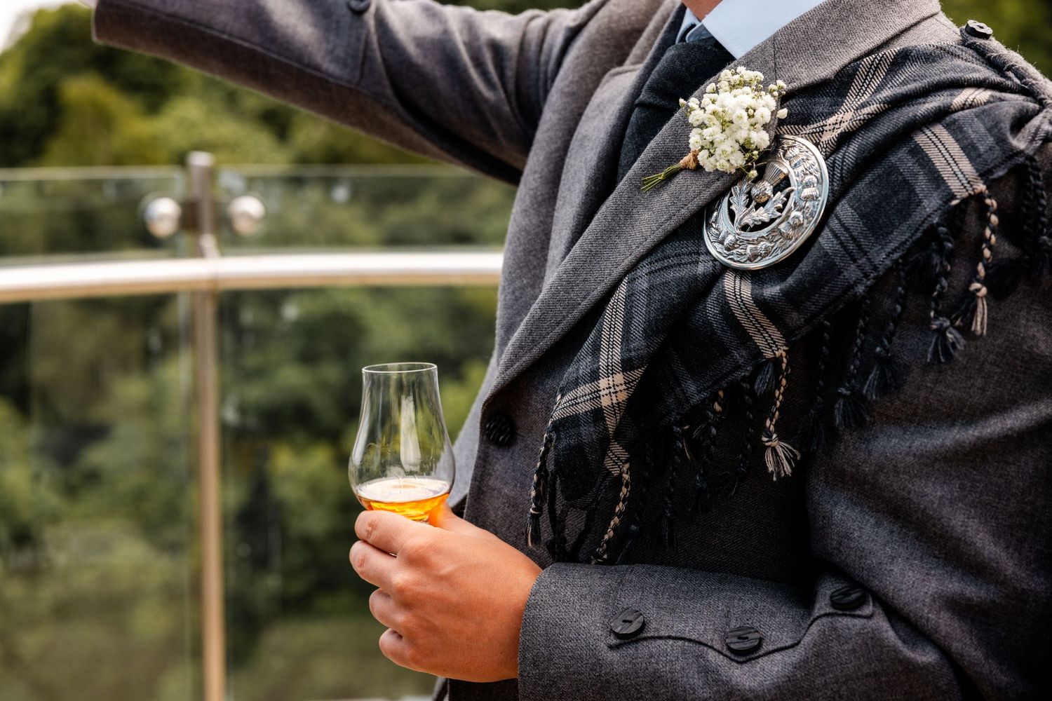 Groom  having drink, Glass House Edinburgh, Scotland,