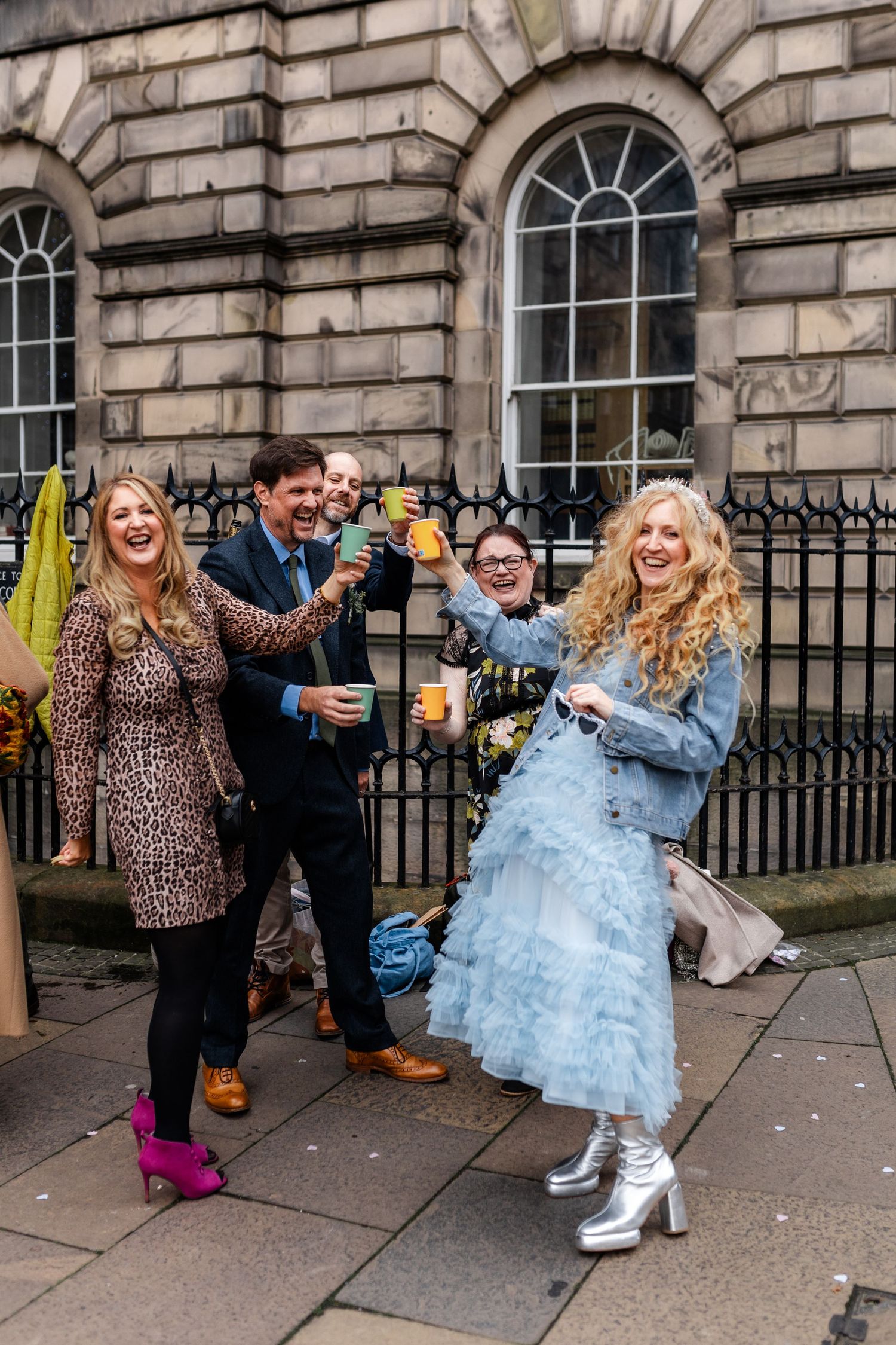 Untraditional wedding dress, blue dress. Cheers with guests. Edinburgh Wedding, City Chambers Wedding