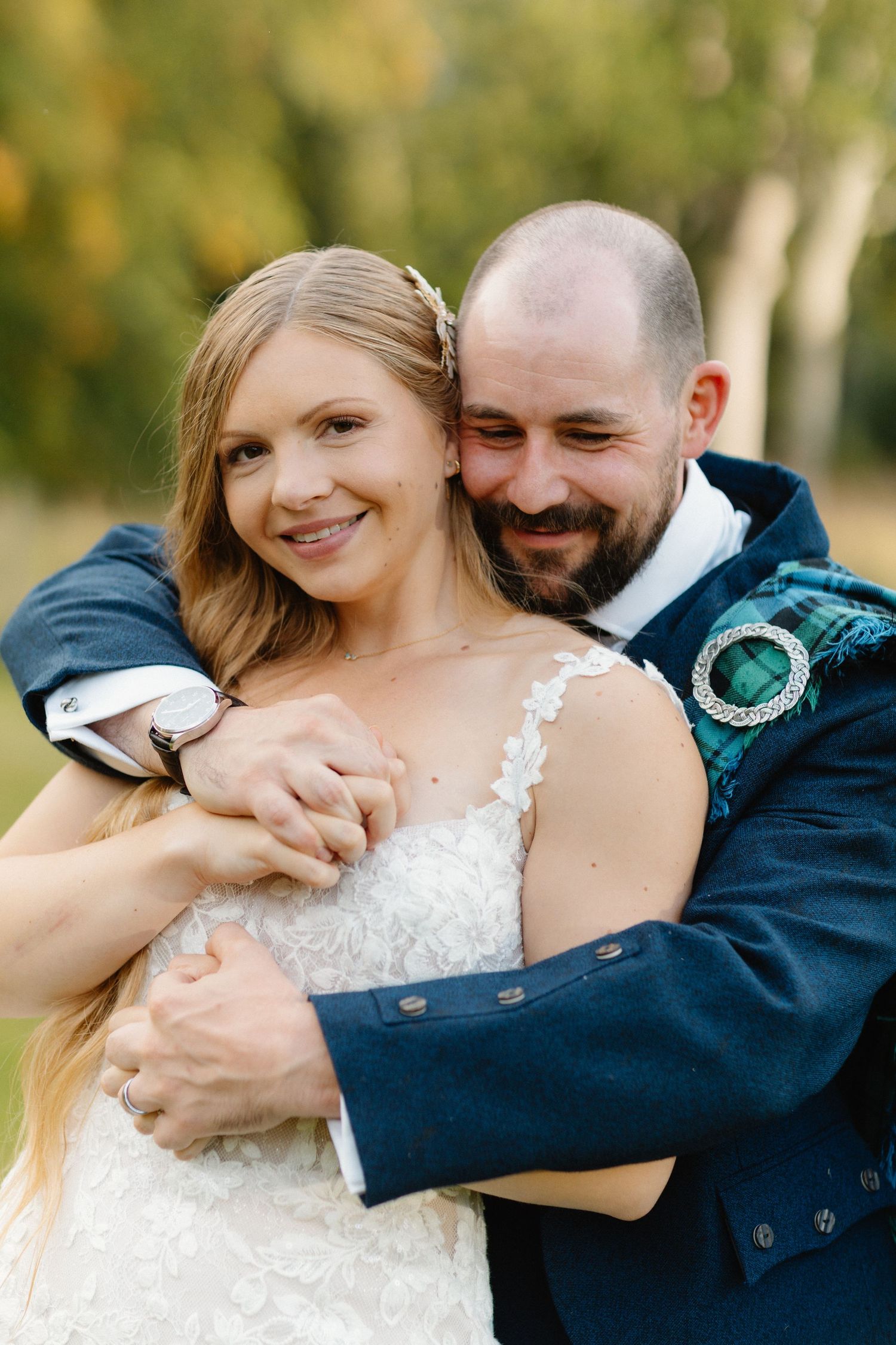 A romantic series of wedding photos showing tender embraces between a couple in formal attire outdoors.