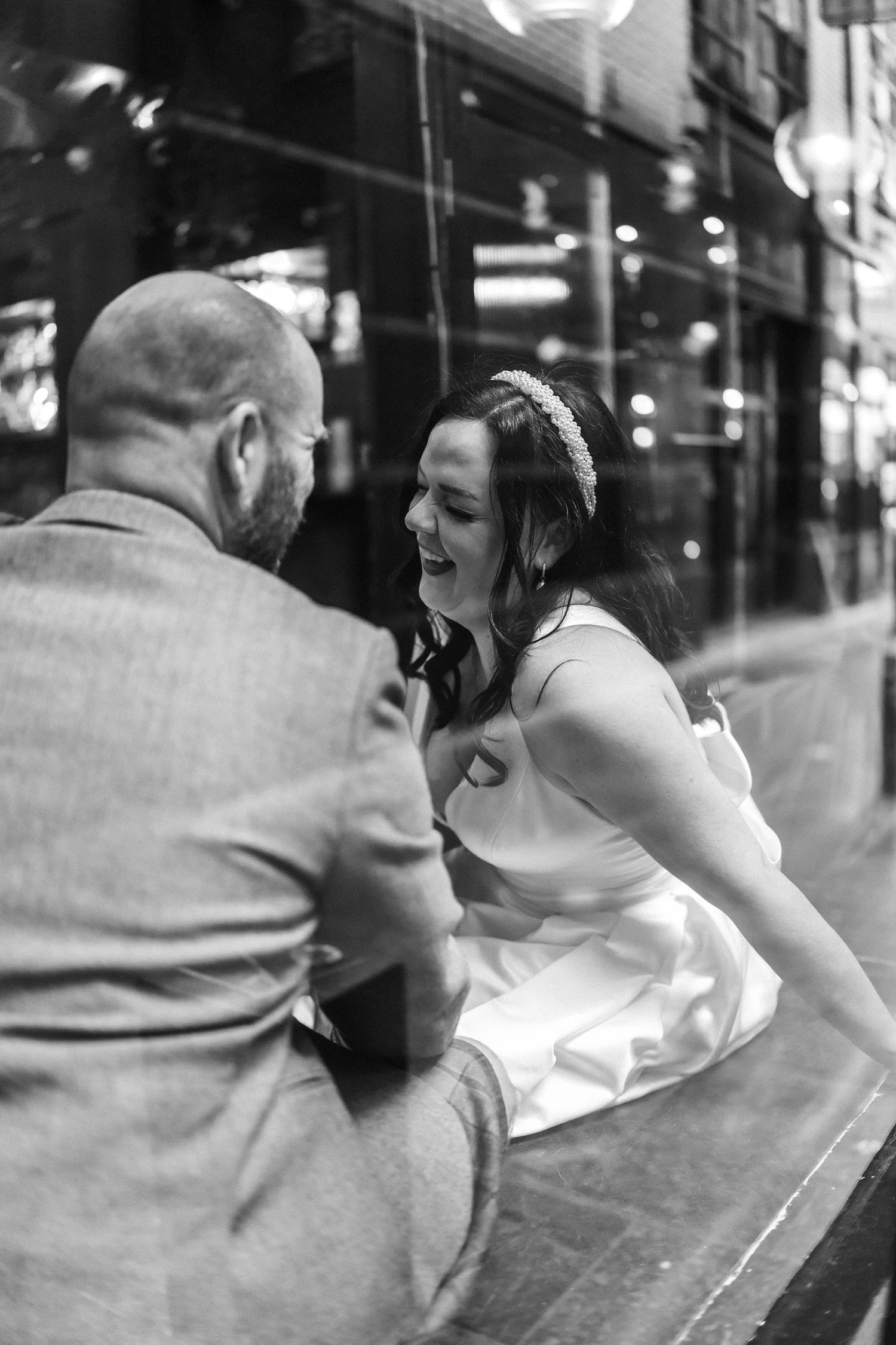 Black and white candid wedding photos capturing intimate moments between newlyweds.