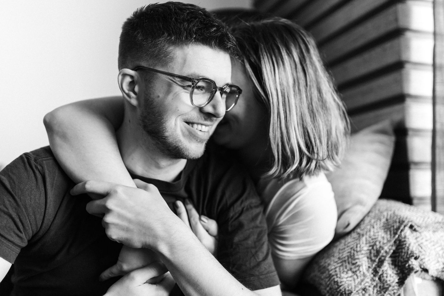 Intimate black and white portraits showing tender moments between a couple.