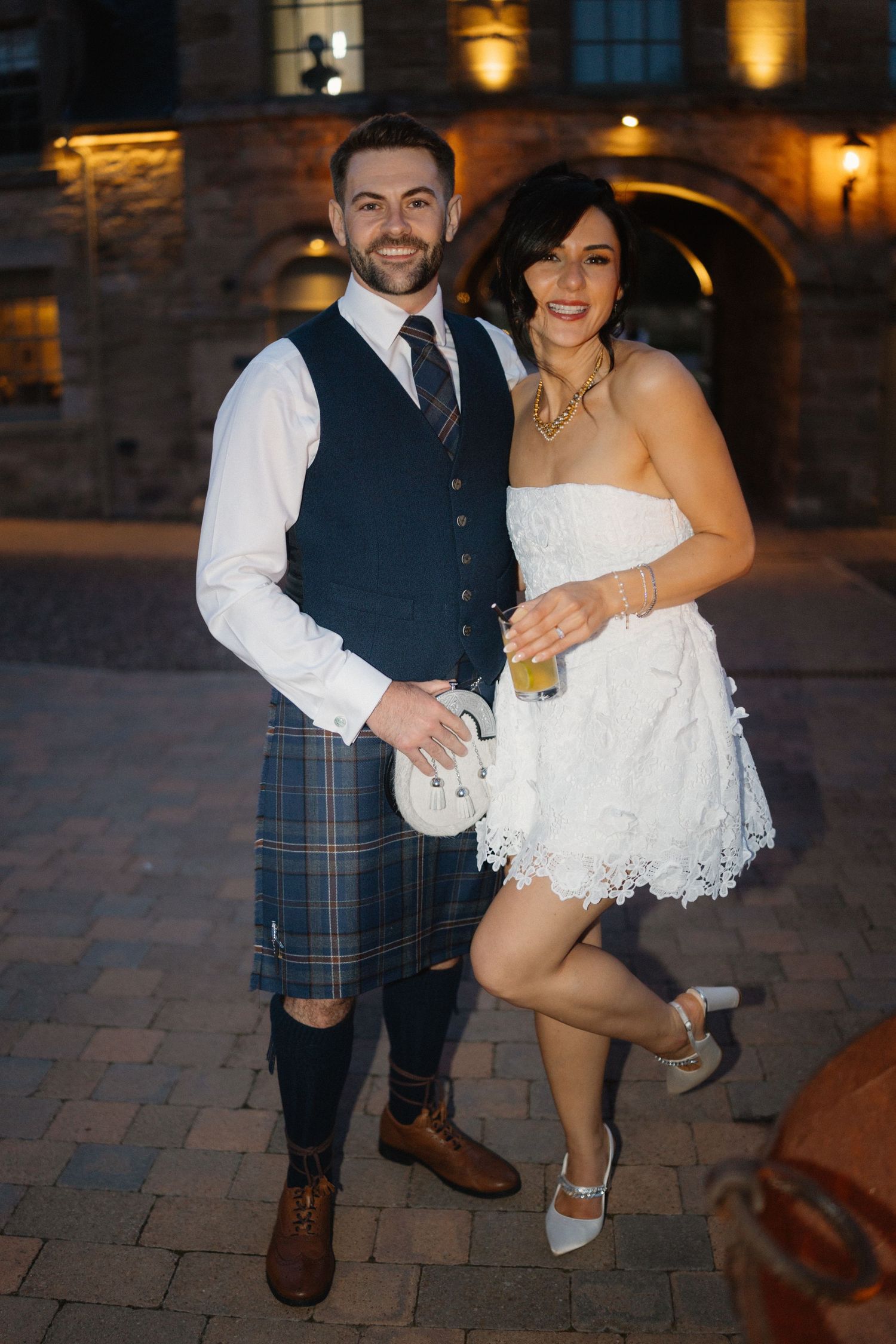Wedding party, bride short dress, at Rosebery Steading, Temple, Gorebridge, Scotland.