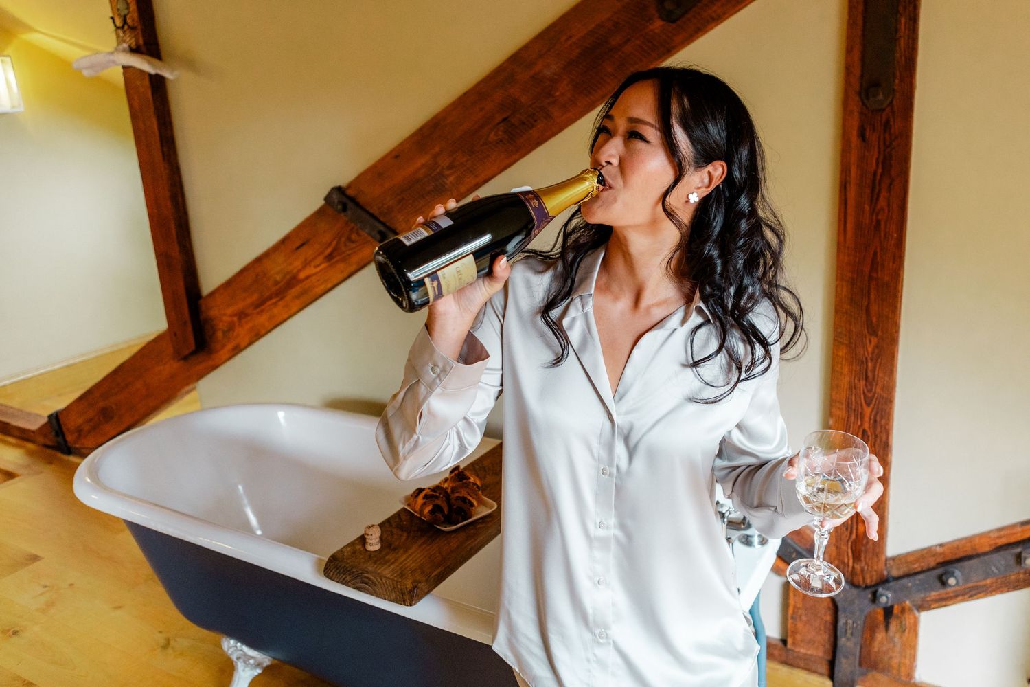 Natural light illuminates joyful wedding day preparation moments.