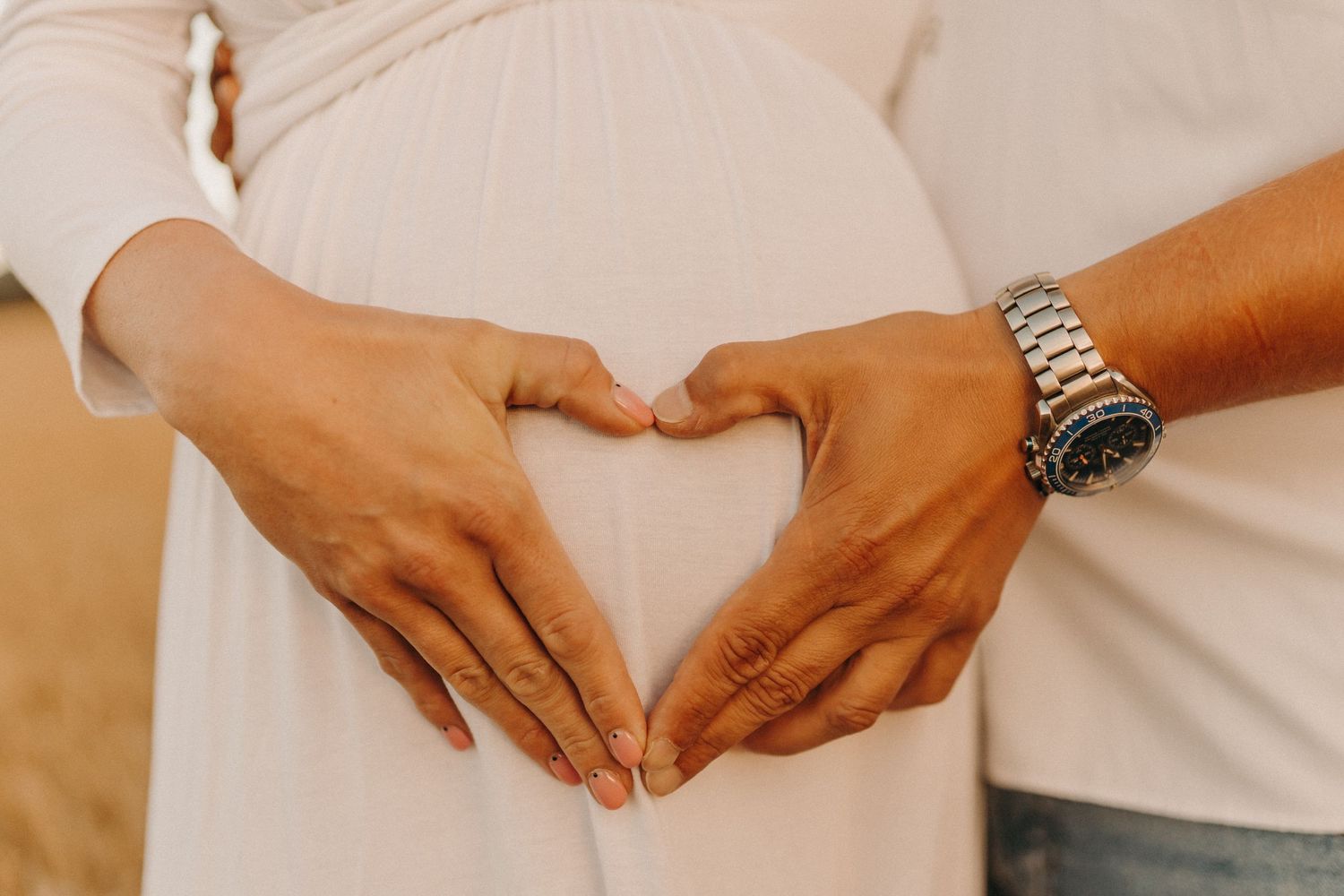 Close-up of hands with rings showing intimate moments.