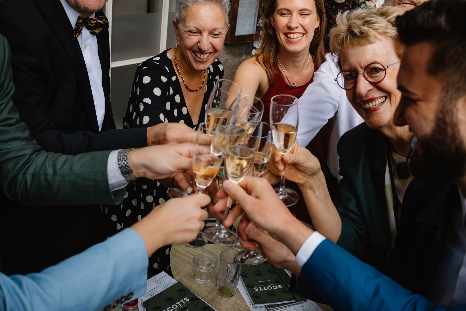 Wedding celebration with a glass of fizz in Scotts Restaurant in Edinburgh Scotland